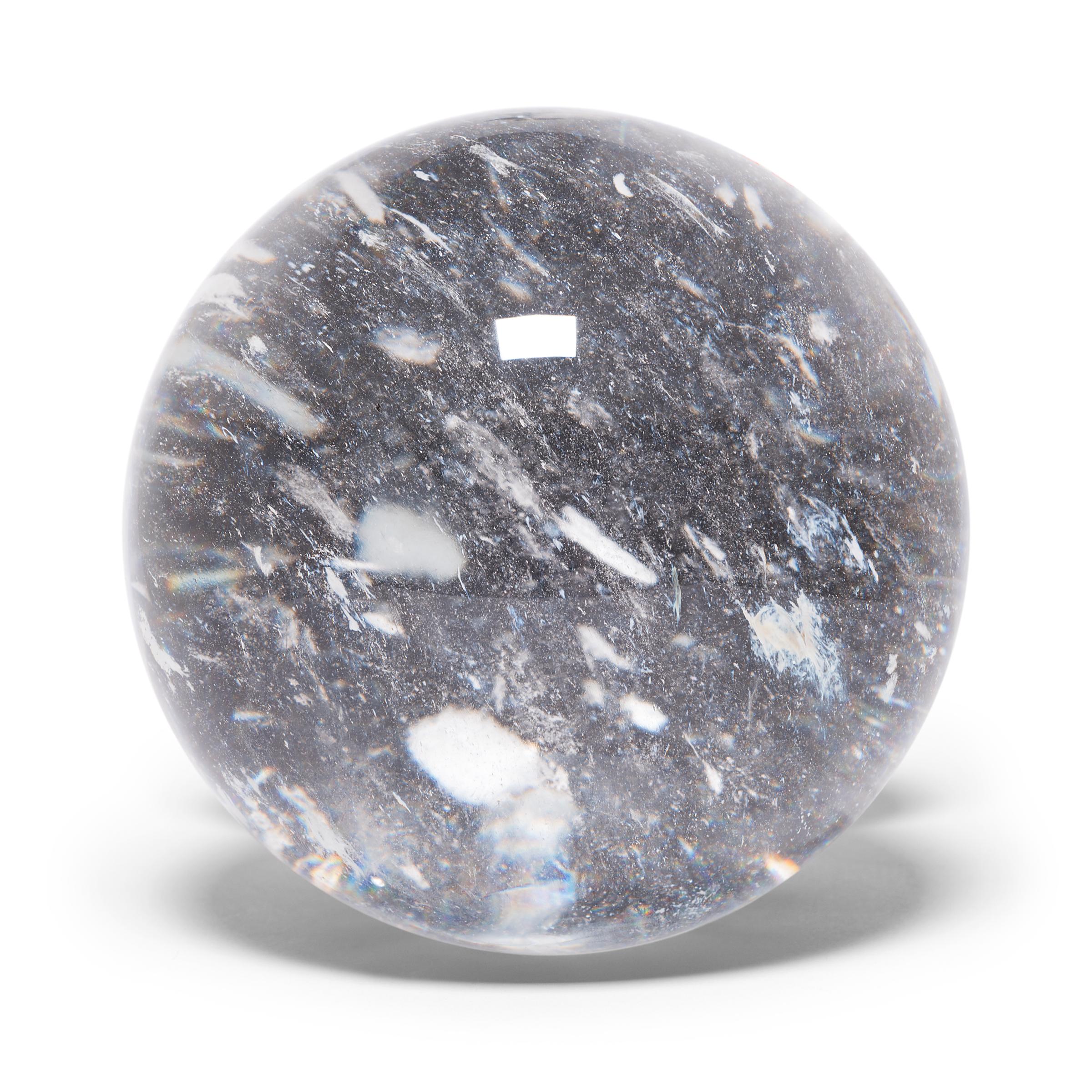 Gem lore is endless, and every culture has its own beliefs about specific stones tied to cultural history, geography, and spiritual practices. In China, some practitioners of feng shui value clear quartz, like this beautiful crystal ball, for its