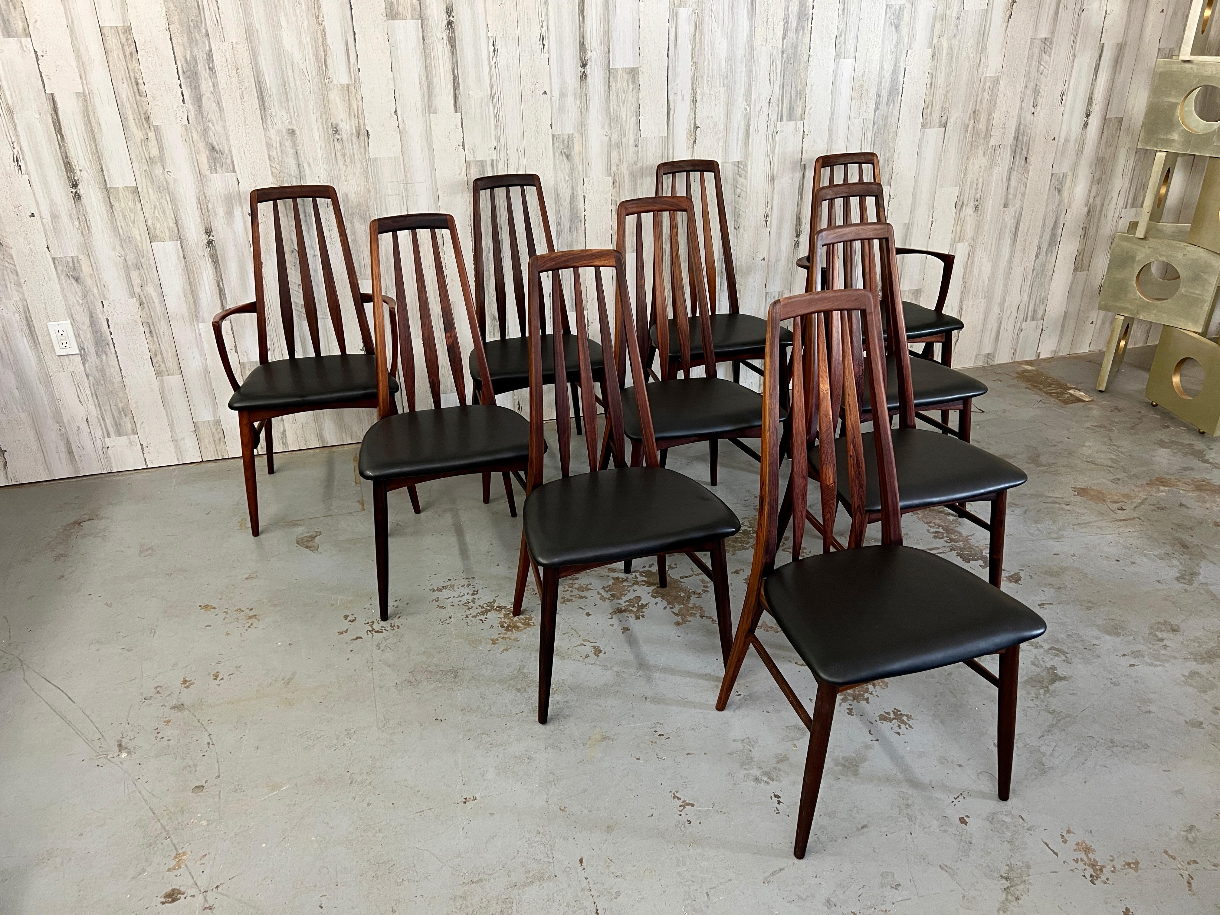 Rare set of ten solid rosewood dining chairs designed by Niels Korfoed The Eva chair set is comprised of 8 side chairs and two arm chairs some have newer vinyl seats but match well.
2 arm chairs chairs measure 20.3/4s deep by 20.3/8s wide 37.5/8s