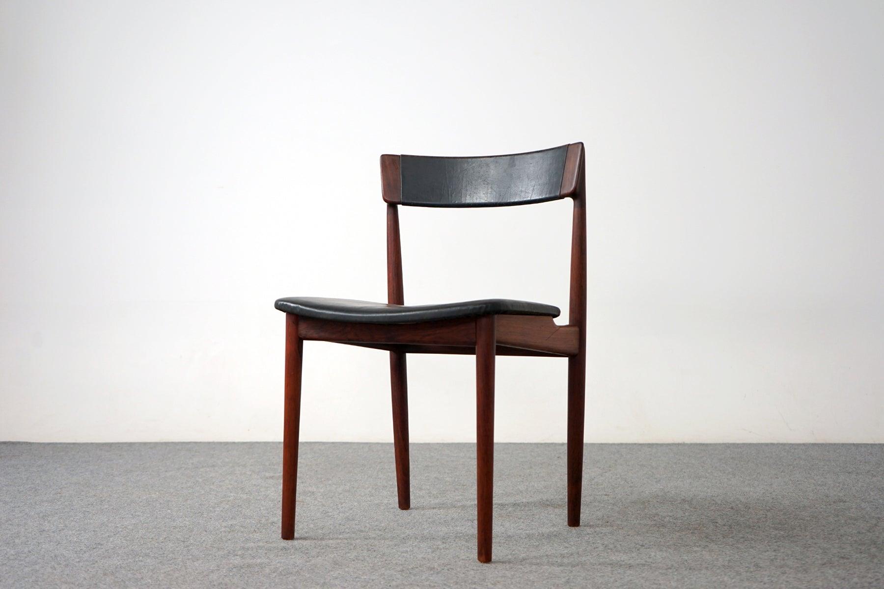 A set of 10 rosewood dining chairs by Henry Rosengren Hansen for Brande Mobelindustri, circa 1960's. Beautifully curved backrests and generous seat design provide support and comfort. Solid wood legs feature cross braces for added stability and
