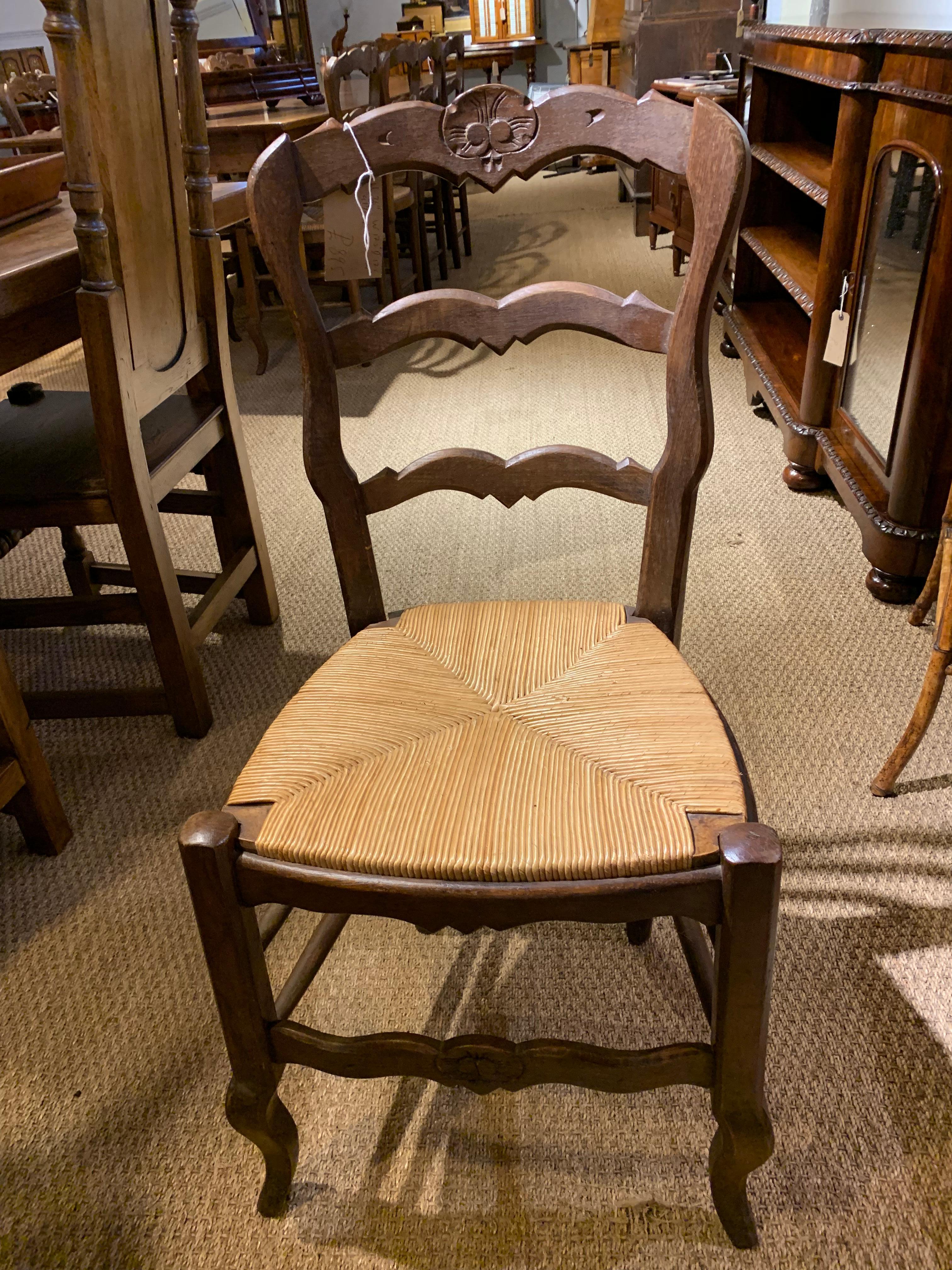 Good set of 10 oak and rush seated chairs, dating to circa 1930s, the rush seating in good order and all the joints are firm. 

Measures: Height 36 inches 
Width 17 .5inches 
Depth17.5 inches.