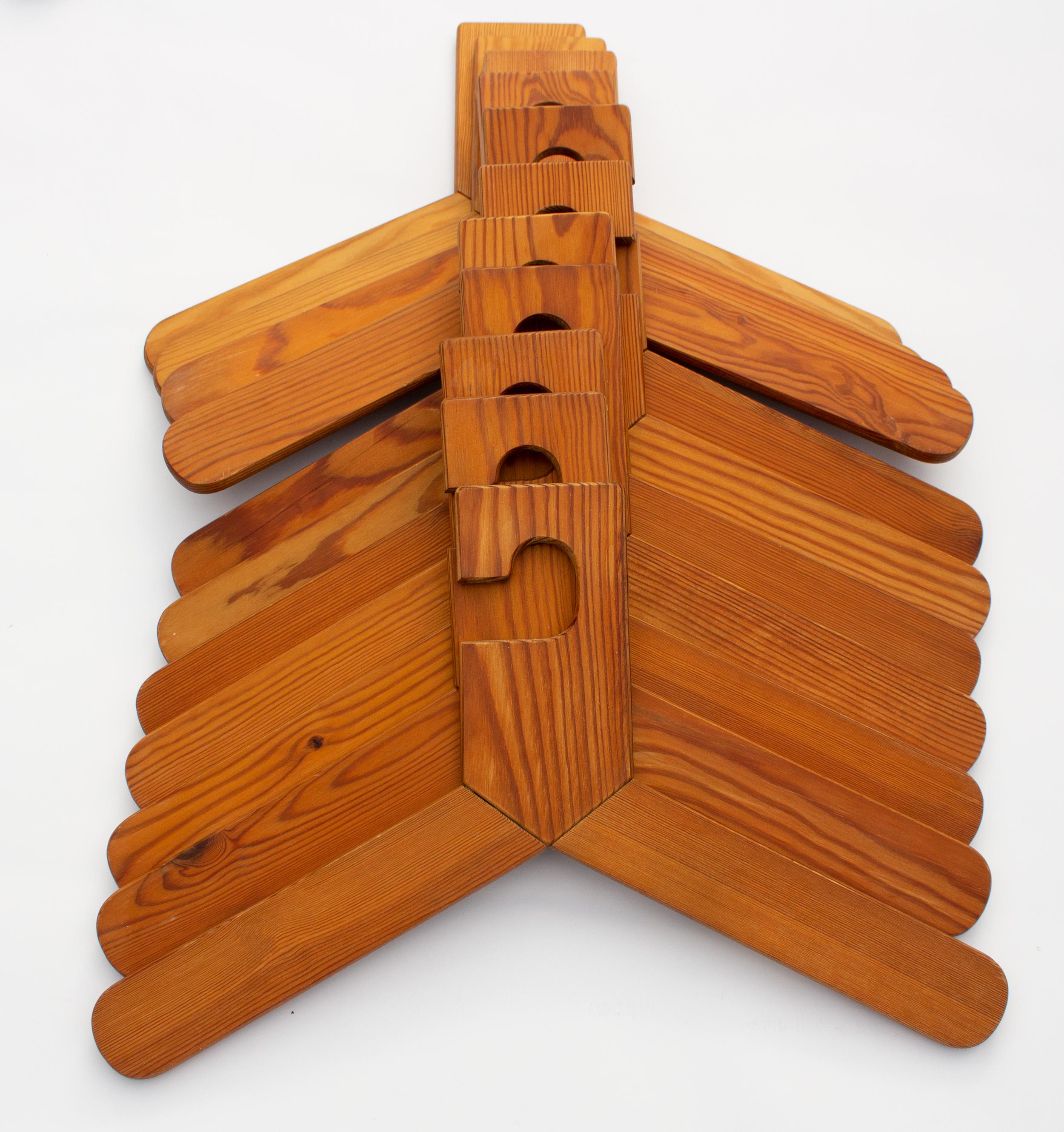 Scandinavian Modern hangers in wood from Sweden, made out of Fir. Surprise yourself with stylish handmade hangers in your wardrobe in the style of Axel Einar Hjort.