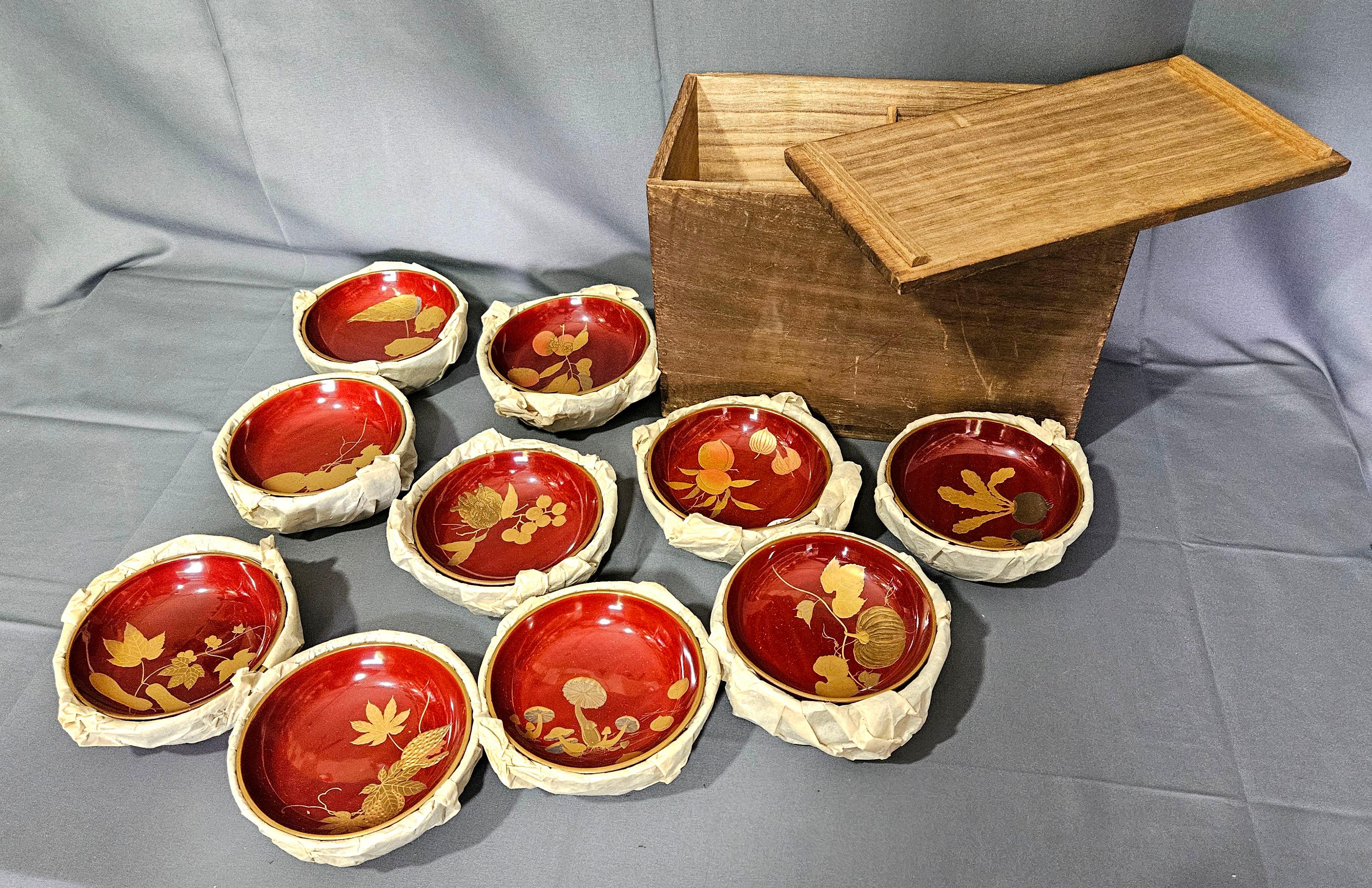 Amazing 10 Sets of Japanese Gilt Rice Lacquer Bowls w/ Covers from the 19 Century. There are a total of 20 pieces with the original lidded wooden box. 
There are 3 different guilt paintings on each set with the same themes of objects. The entire set
