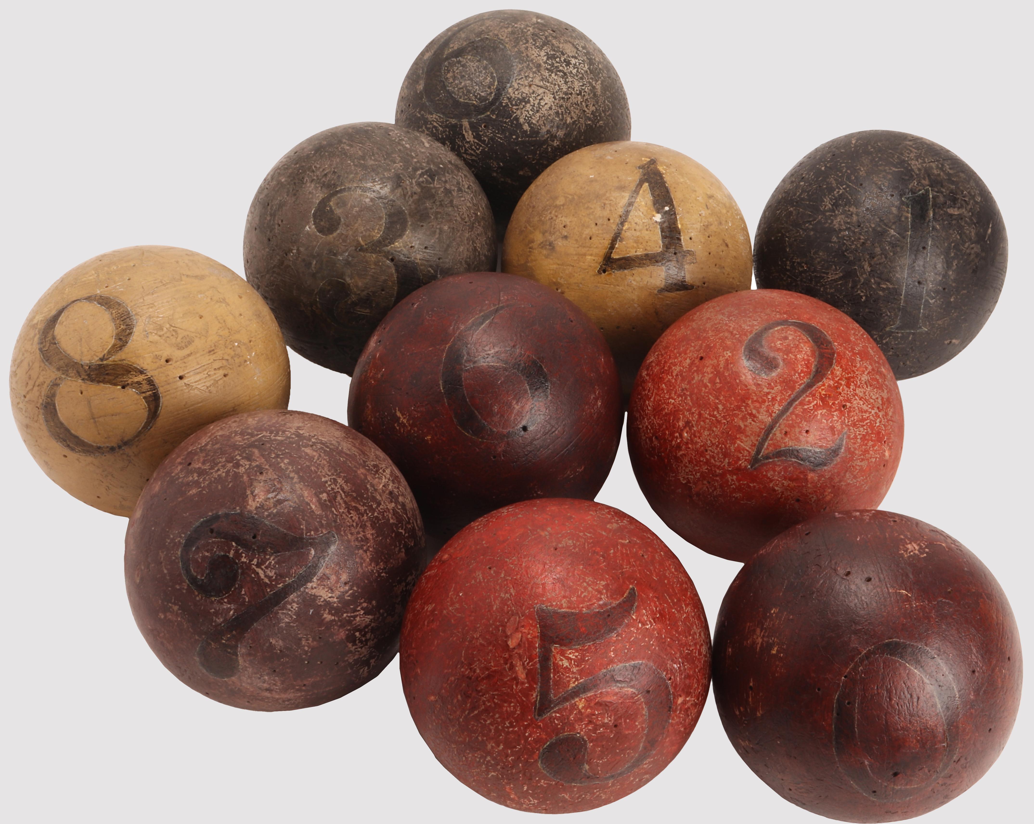 The ball weight riddle. There are 10 painted wood balls available, same circumference, all of them, numbered from 0 to 9, 9 of which have the same weight and only one weight more than the others. The heaviest one must be identified by having only