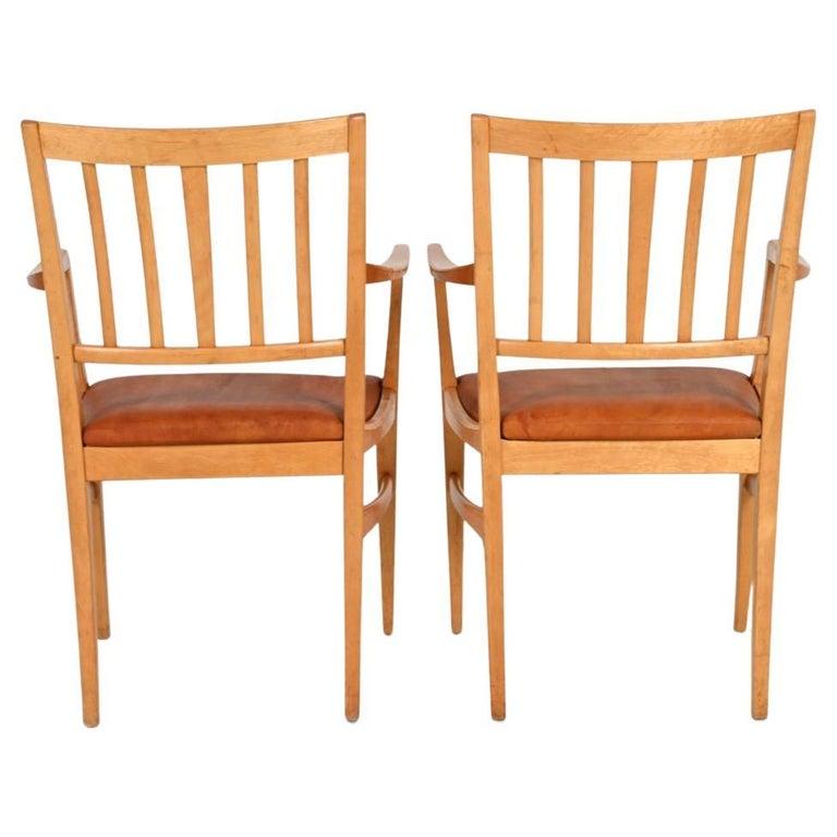 Travail du bois 10 chaises de salle à manger suédoises à dossier à lattes, conçues par Carl Malmsten, dans le style moderne du milieu du siècle dernier en vente