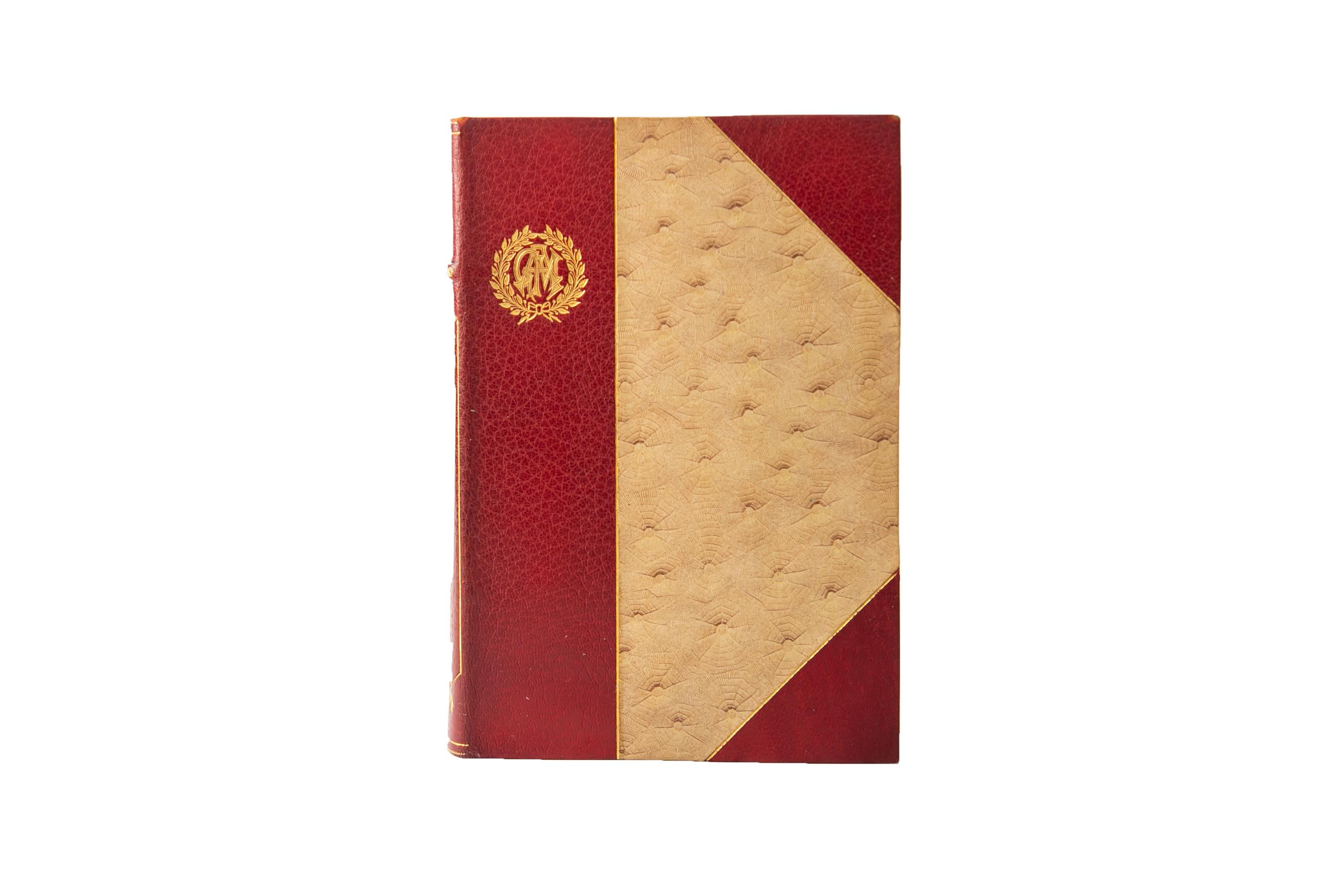10 volumes. George Eliot, The complete works. St. James Edition. Bound in 3/4 red morocco and textured linen boards, bordered in gilt tooling with a gilt-tooled crest on the top left corner of the covers. Raised bands with floral details and label