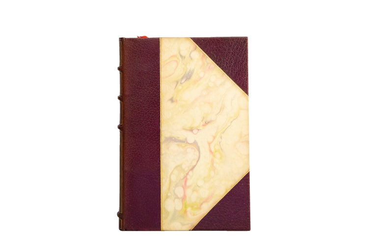 10 Volumes. Michel de Montaigne, The Works of Michel de Montaigne. Bound in 3/4 purple morocco and marbled boards. The marbled boards are bordered by gilt. Raised band spine with elaborate gilt detailing on panels and label lettering. The top edge