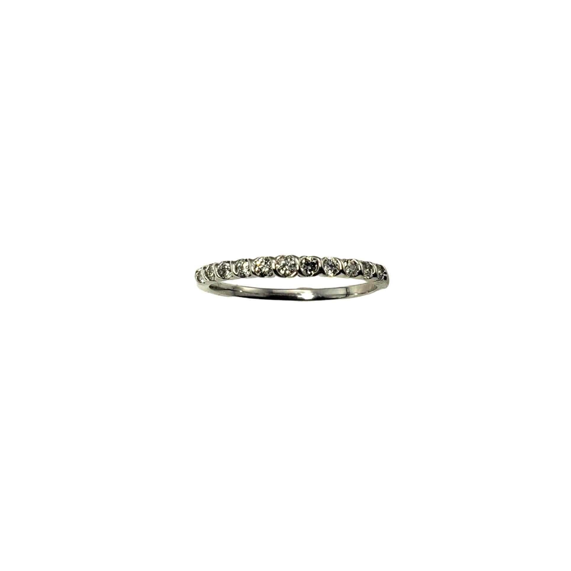 Vintage 10 Karat White Gold Diamond Band Ring Size 7-

This sparkling band features 11 round brilliant cut diamonds set in classic 10K white gold. Width: 2 mm.

Approximate total diamond weight: .33 ct.

Diamond color: H-I

Diamond clarity: