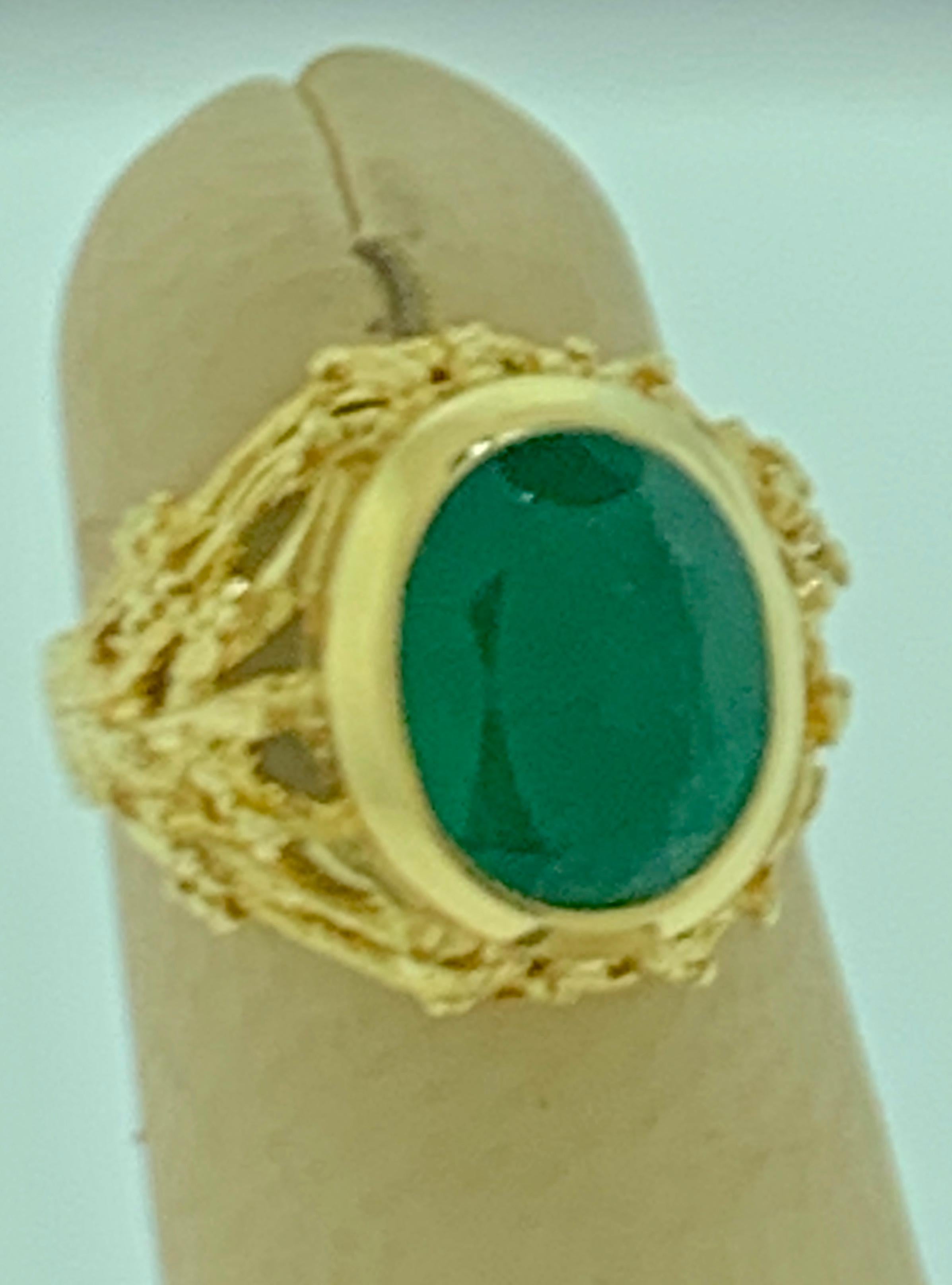 
10 X 12 MM Oval Cut approximately 7 Ct Natural Emerald Ring 18 Karat Yellow Gold Size 4.5
Oval shape Emerald Ring
Natural Emeralds are very precious , Very Difficult to find and getting more more difficult to find.
A classic, Cocktail ring 
Emerald