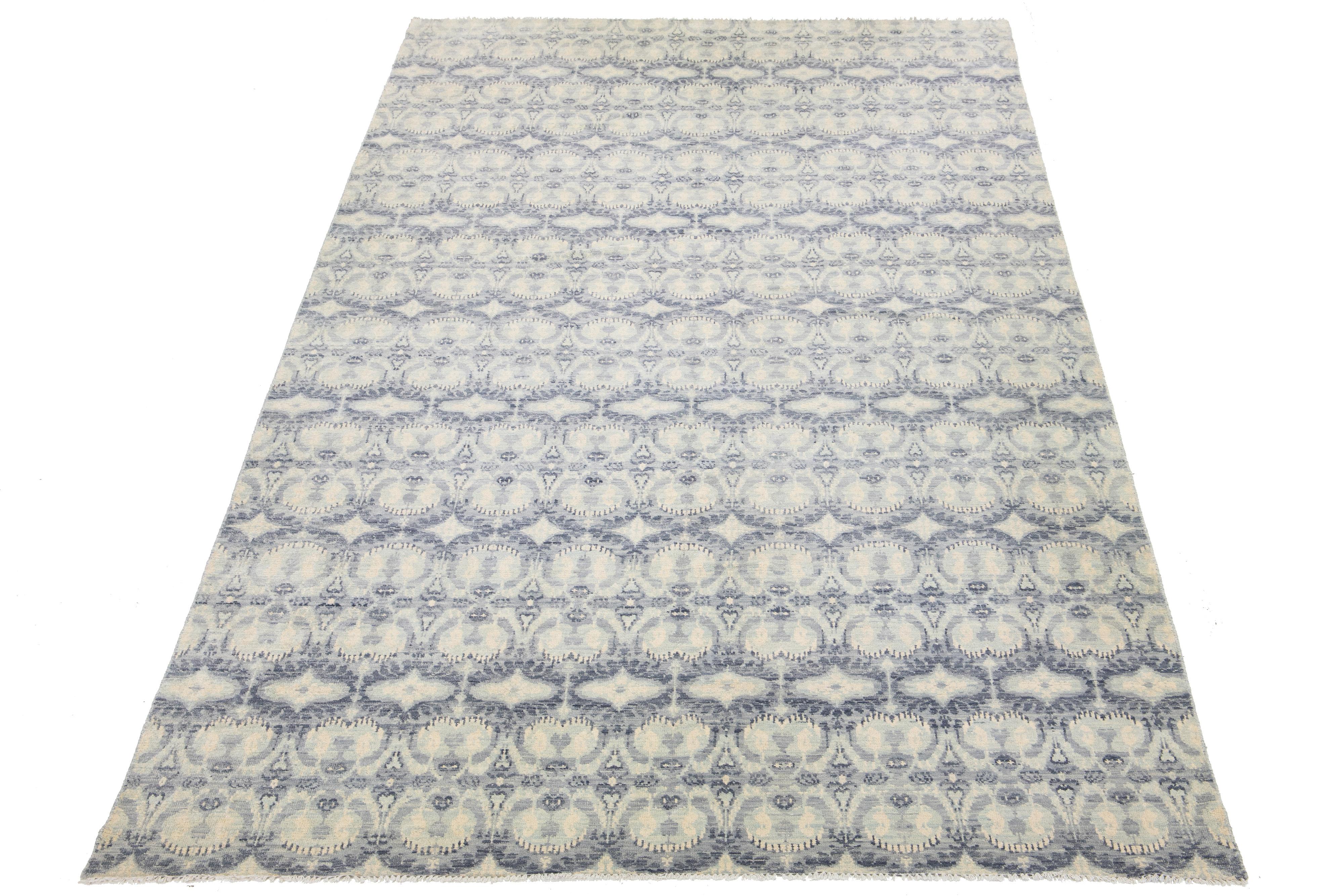 This stunning Ikat rug is hand-knotted from wool and features a beautiful pale blue color field. Its all-over geometric design is enhanced by elegant light gray, light blue, and ivory hues, making it a gorgeous addition to any modern space.

This
