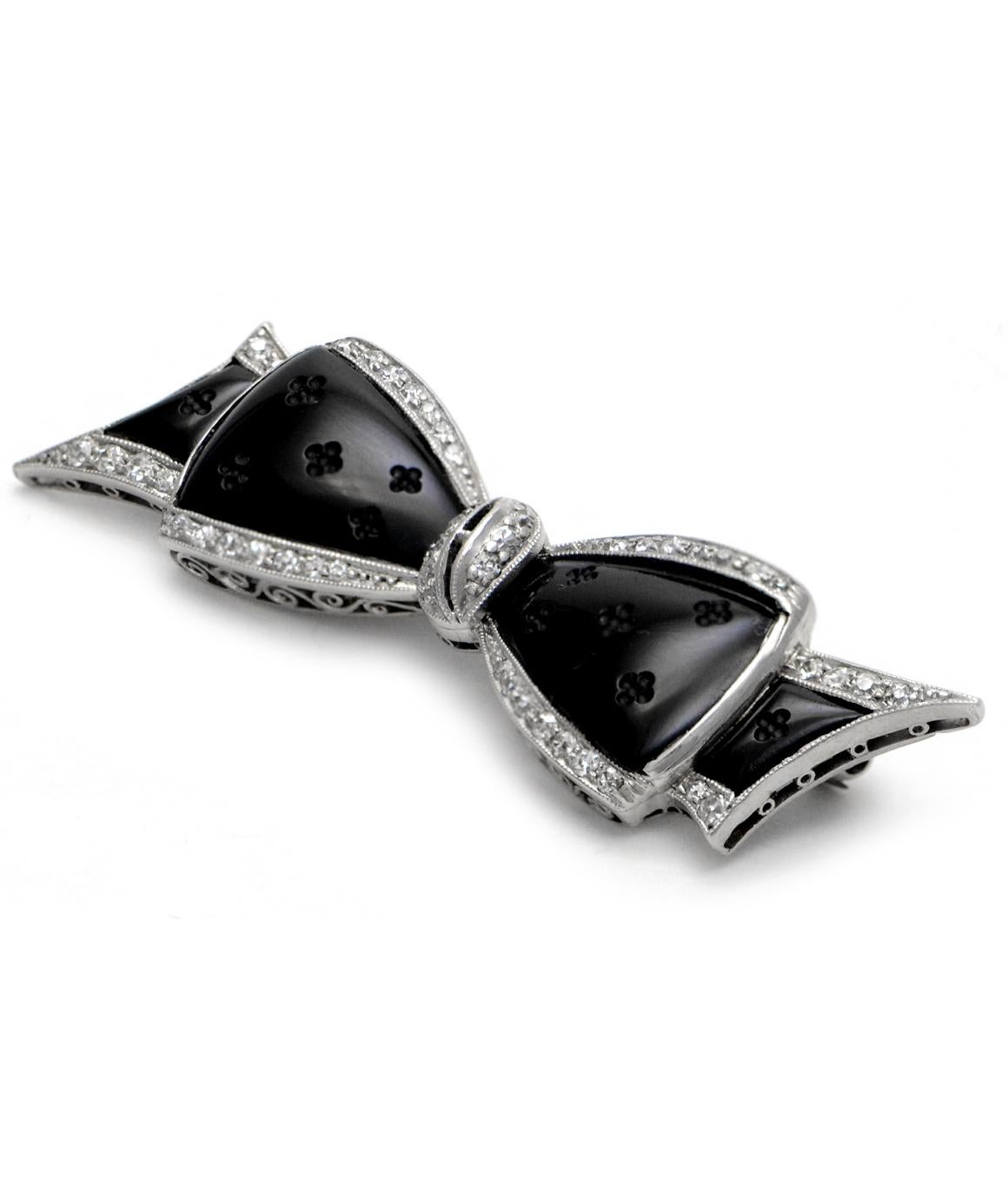 100% Authentic J.E Caldwell & Co Pure Platinum Designer Diamond & Carved Onyx Bow Brooch 7.3 grams 
This stunning designer brooch weighs 7.3 grams, and measures about 2.00