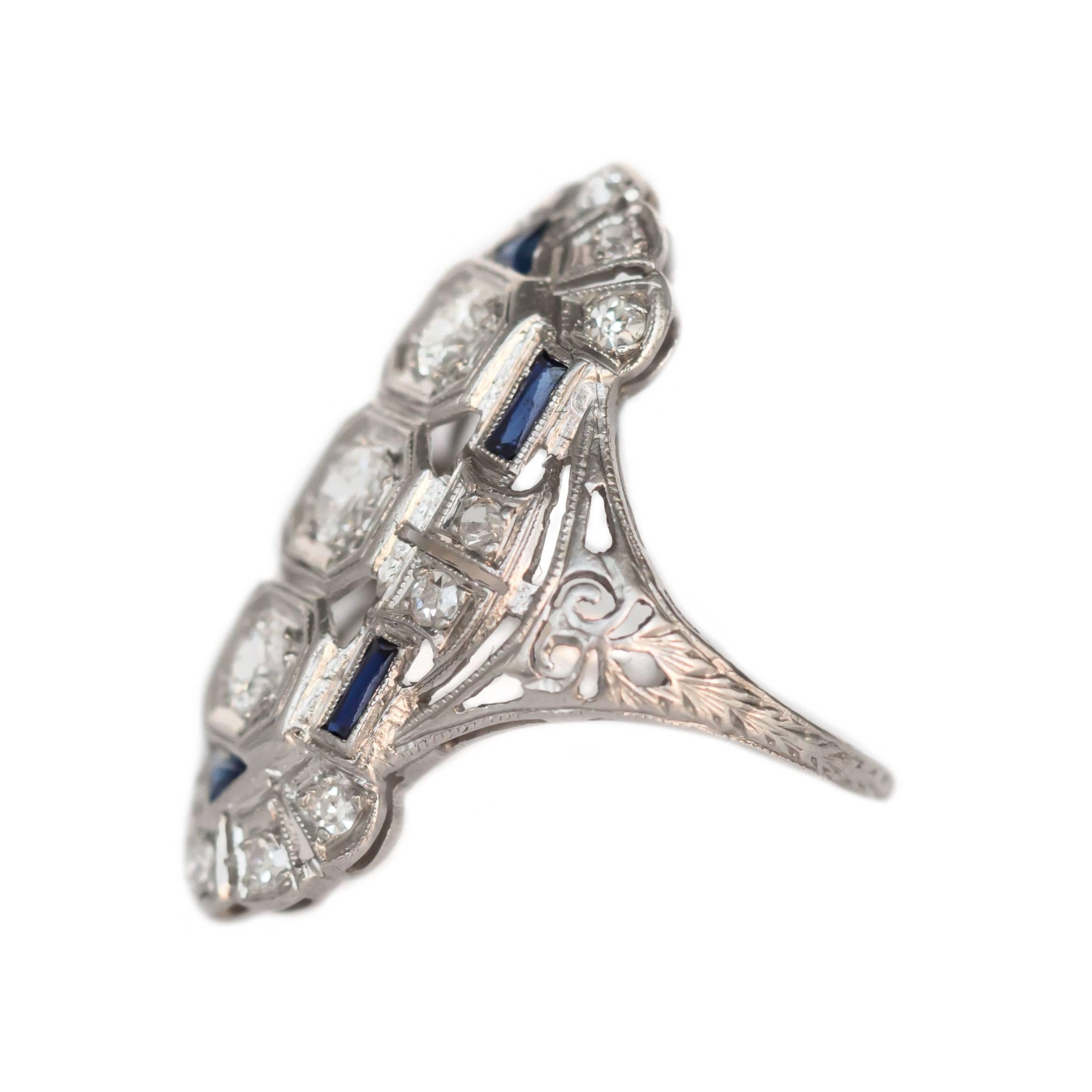 Item Details: 
Ring Size: 5
Metal Type: Platinum 
Weight: 5.2 grams

Side Stone Details: 
Shape: Old European Brilliant 
Total Carat Weight: 1.00 carat, total weight
Color: F-G
Clarity: SI1

Color Stone Details: 
Type: Sapphires
Shape: French Cut