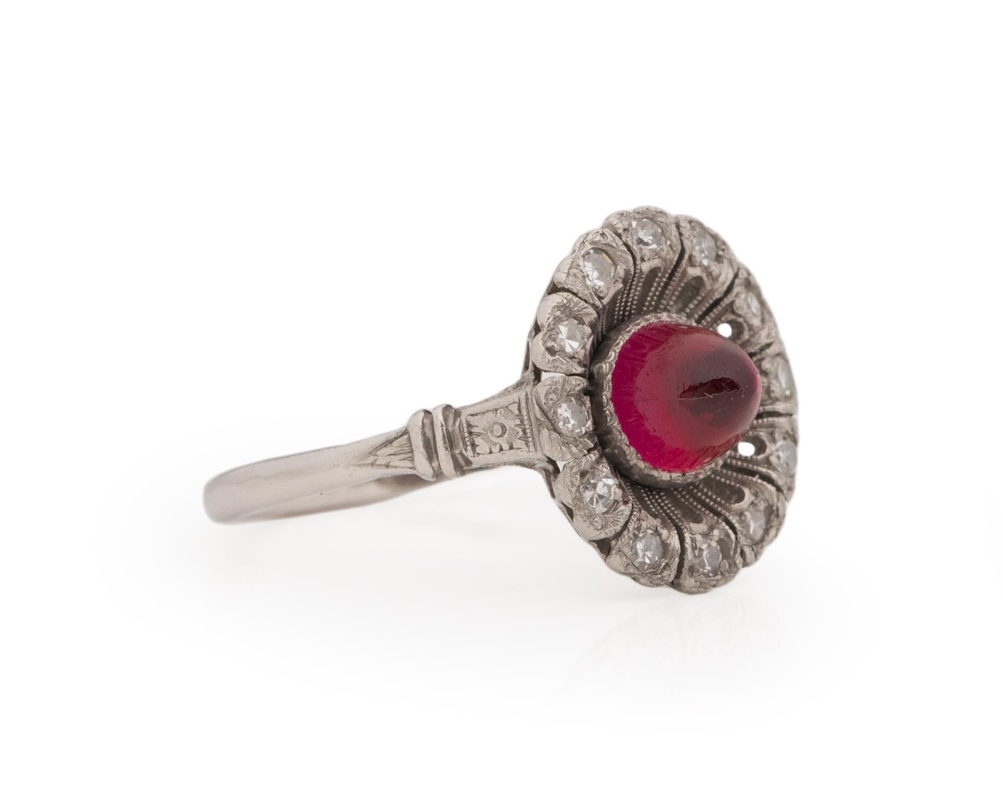 Ring Size: 7.5
Metal Type: Platinum [Hallmarked, and Tested]
Weight: 3.0 grams
Center Stone Details: 
Type: Ruby (Created)
Size: 1.00ct
Color: Red
Shape: Cabachon
Diamond Details:
Weight: .25ct, total weight
Cut: Old European brilliant
Color:
