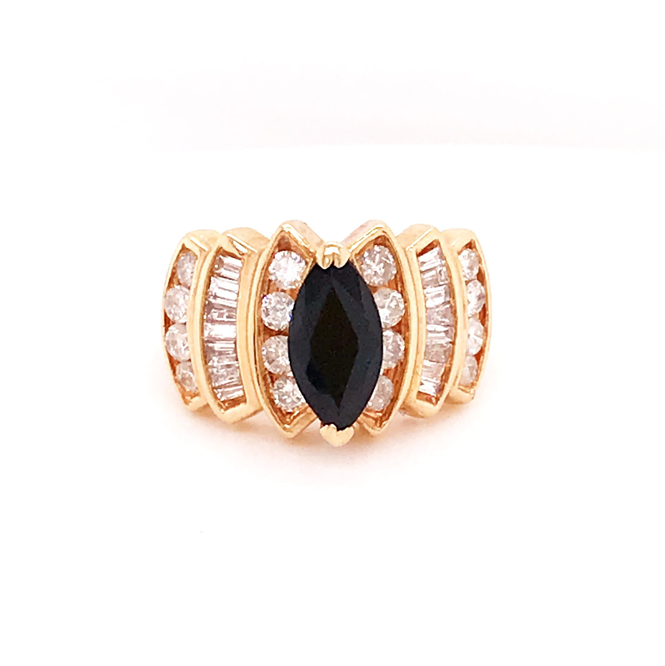 Custom Estate Sapphire and Diamond Ring. With a marquise shaped, genuine, deep blue sapphire gemstone set in a secure 