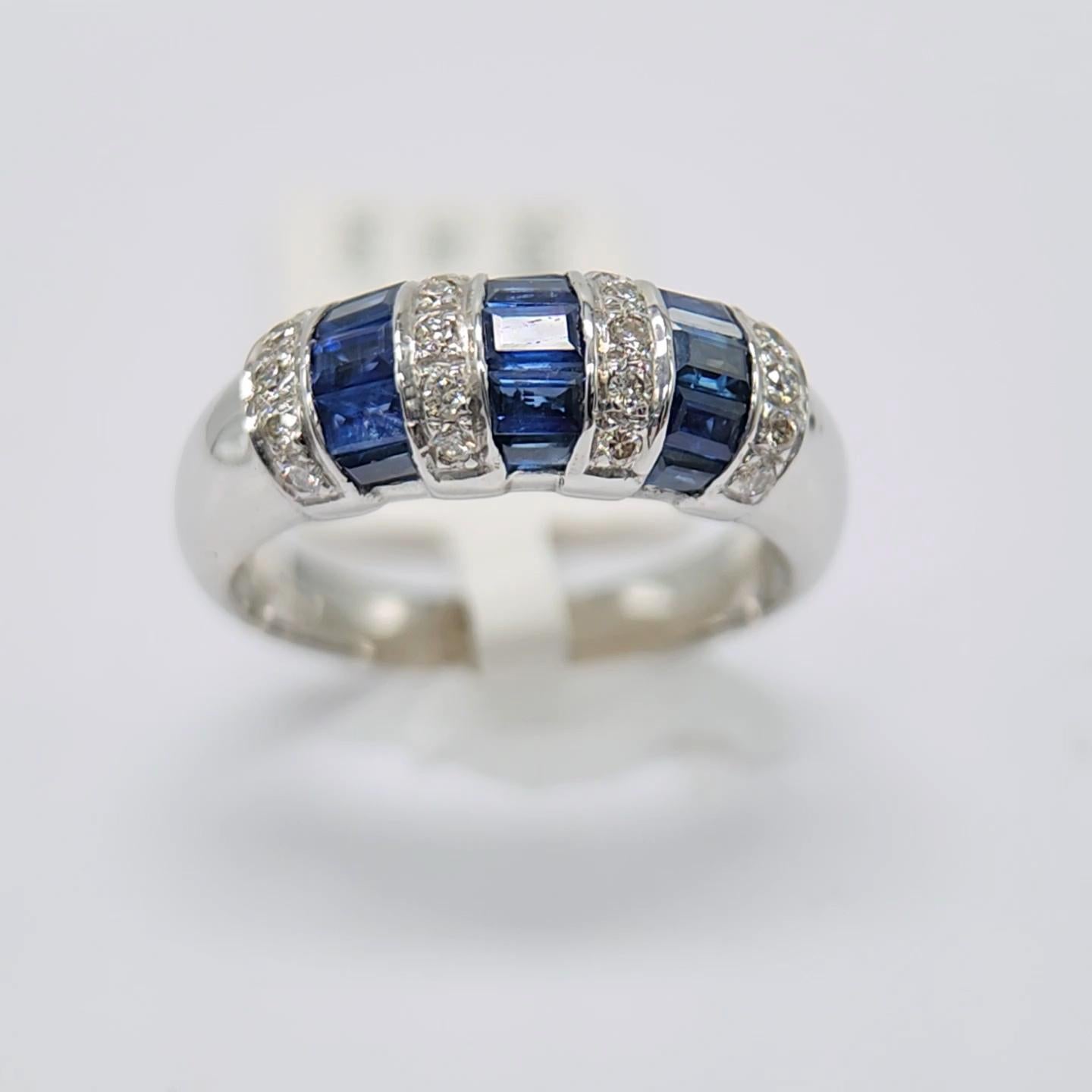Artisan 1.00 Carat Blue sapphire Baguette Ring 14 Karat White Gold with Diamonds.