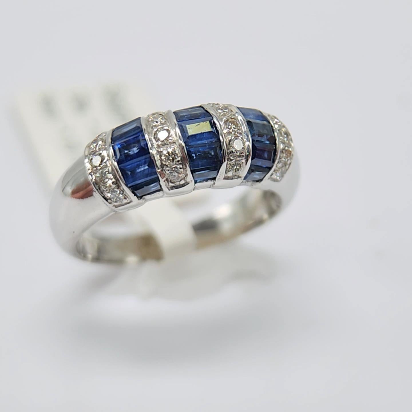 Baguette Cut 1.00 Carat Blue sapphire Baguette Ring 14 Karat White Gold with Diamonds.