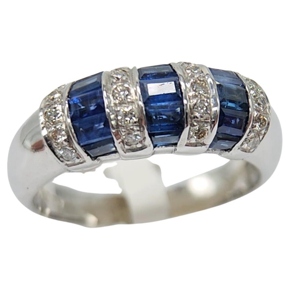 Baguette Shape Sapphire  AAA brilliant deep Blue color 1.00 carat.
Total diamonds 0.20 carat HI - VVS
14k White Gold 5.00Grams, 
Finger Size 7
All stones are natural and none treated.