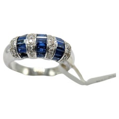 1.00 Carat Blue sapphire Baguette Ring 14 Karat White Gold with Diamonds.
