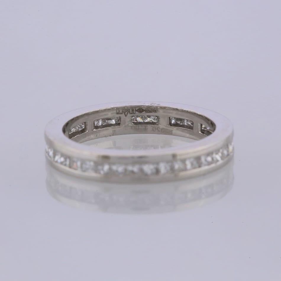 This is a platinum diamond full eternity ring. The ring plays host to 34 channel set princess cut diamonds that cover the whole band of the ring.

Condition: Used (Excellent)
Weight: 5.4 grams
Size: M
Band Width: 3mm
Total Diamond Carat Weight:
