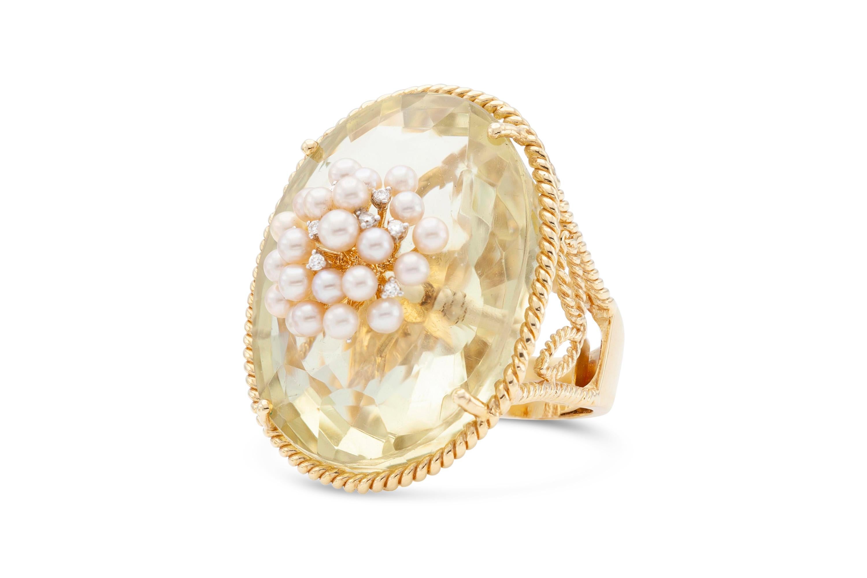 Finely crafted in 18k yellow gold with a 100.00 carat citrine, cultured pearls, and diamonds.