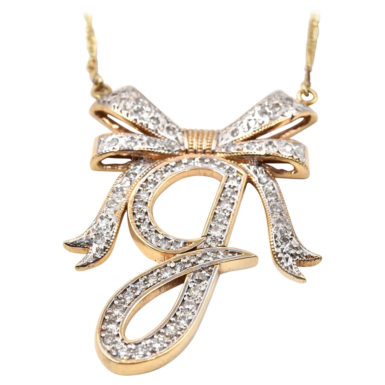 1.00 Carat Diamond 14 Karat Rose Gold “G” Bow Pendant Necklace