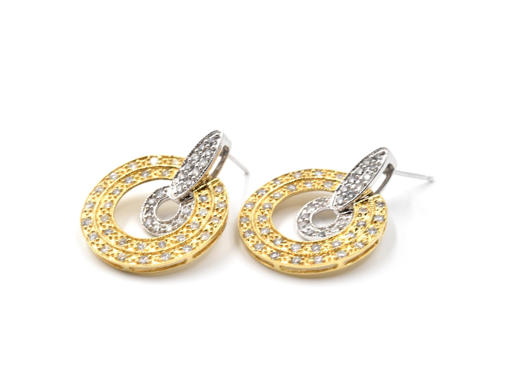 Designer: custom design
Material: 14k white and yellow gold
Diamonds: 98 round brilliant cut = 1.00 carat weight
Color: G-H
Clarity: SI1
Dimensions: each earring is 1-inch long and 3/4-inch wide
Fastenings: friction backs
Weight: 5.96 grams

