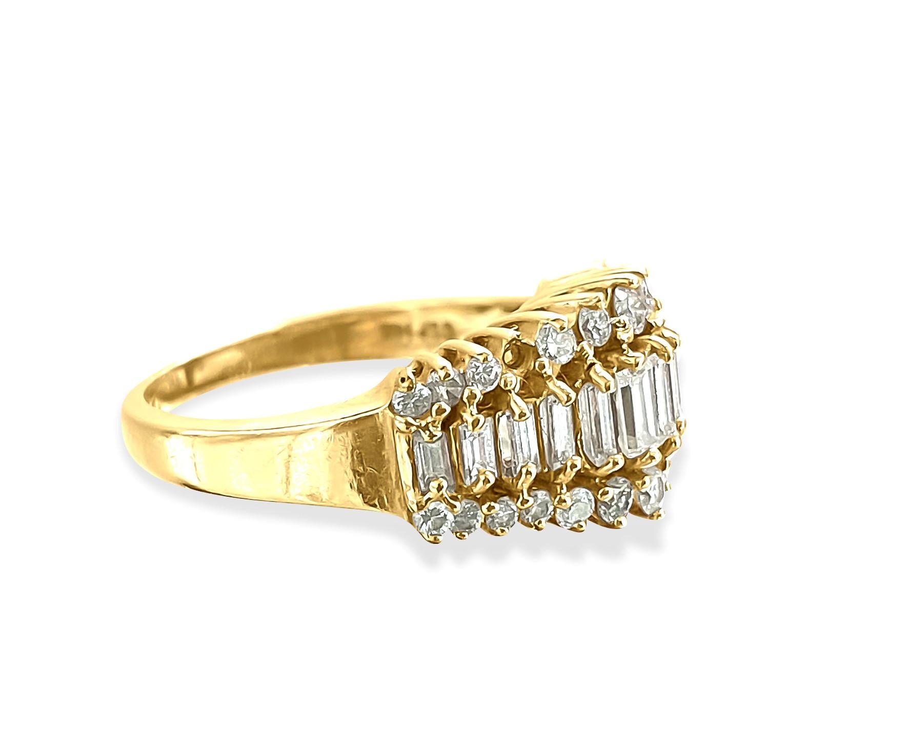Behold this stunning 14K yellow gold ring adorned with a total of 1.00 carats of dazzling diamonds, featuring both round brilliant and baguette cuts, set meticulously in prongs. It boasts VS clarity and F-G color, exuding elegance and