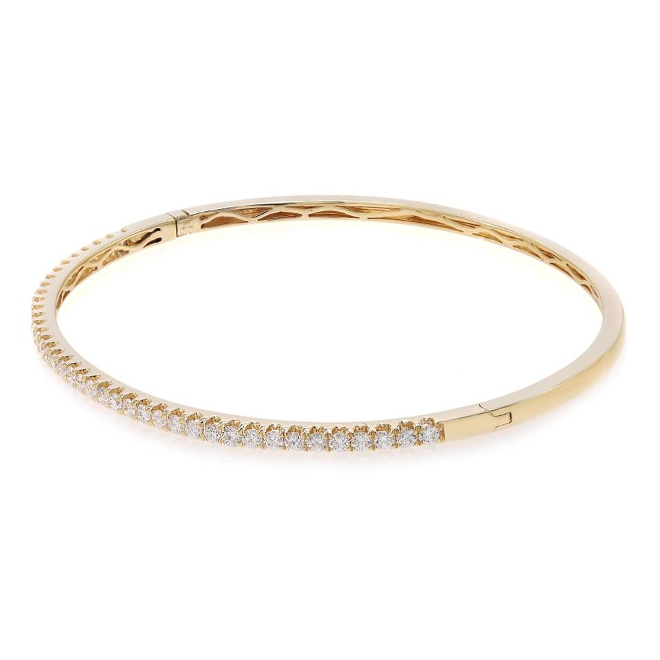 Introducing our versatile and elegant 1.00 Carat Diamond Bangle Bracelet in 18K Yellow Gold. This chic bangle is a true symbol of refined style and sophistication. Adorned with one carats of brilliant round diamonds, meticulously pavé set in 18K