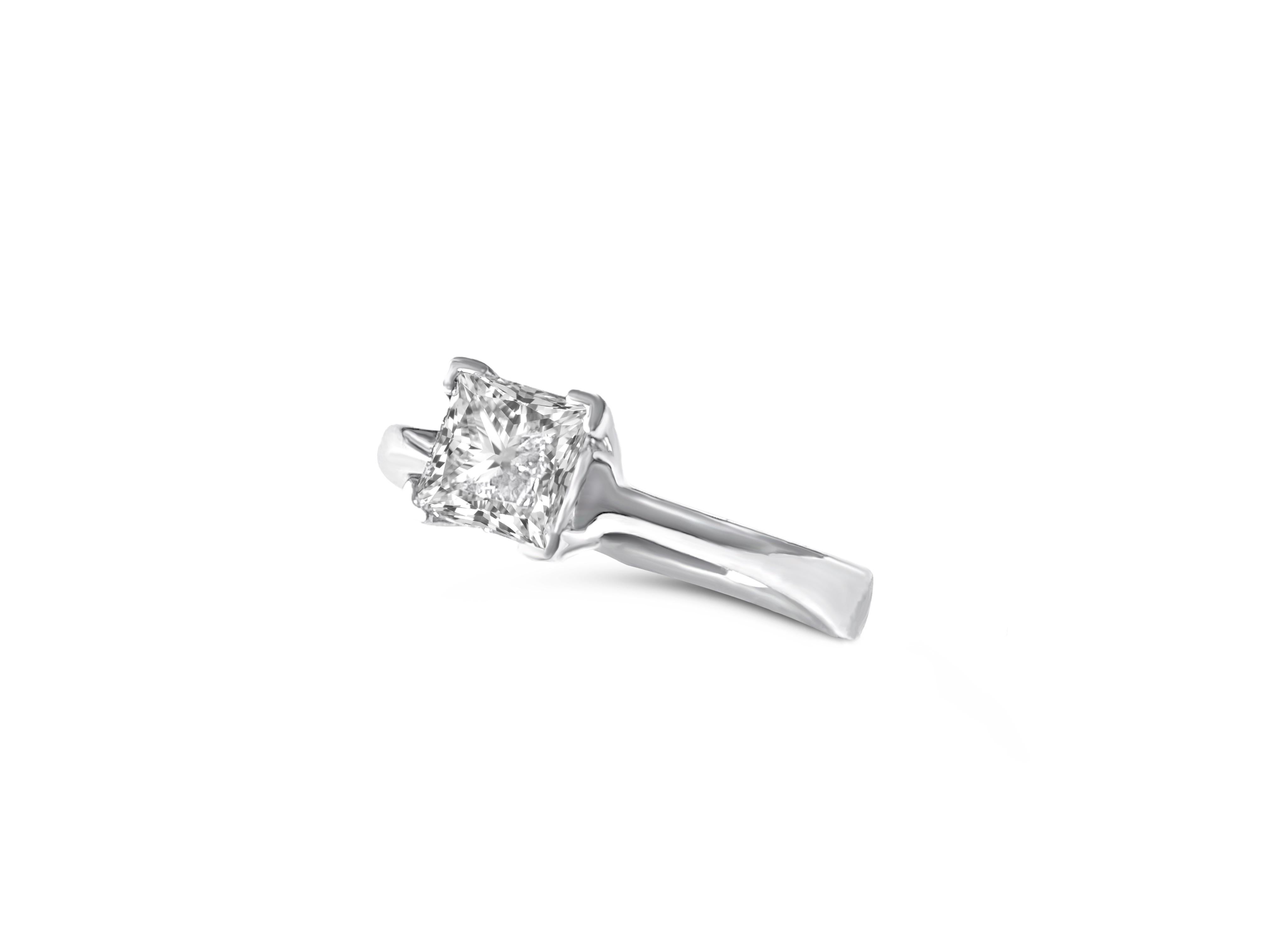 Elegance in a gem, this 14K white gold masterpiece features a dazzling 1.00-carat princess cut diamond, set in prongs for a stunning display. Impeccably clean and clarity enhanced, it's a divine choice for celebrations.

Key Features:

Precious