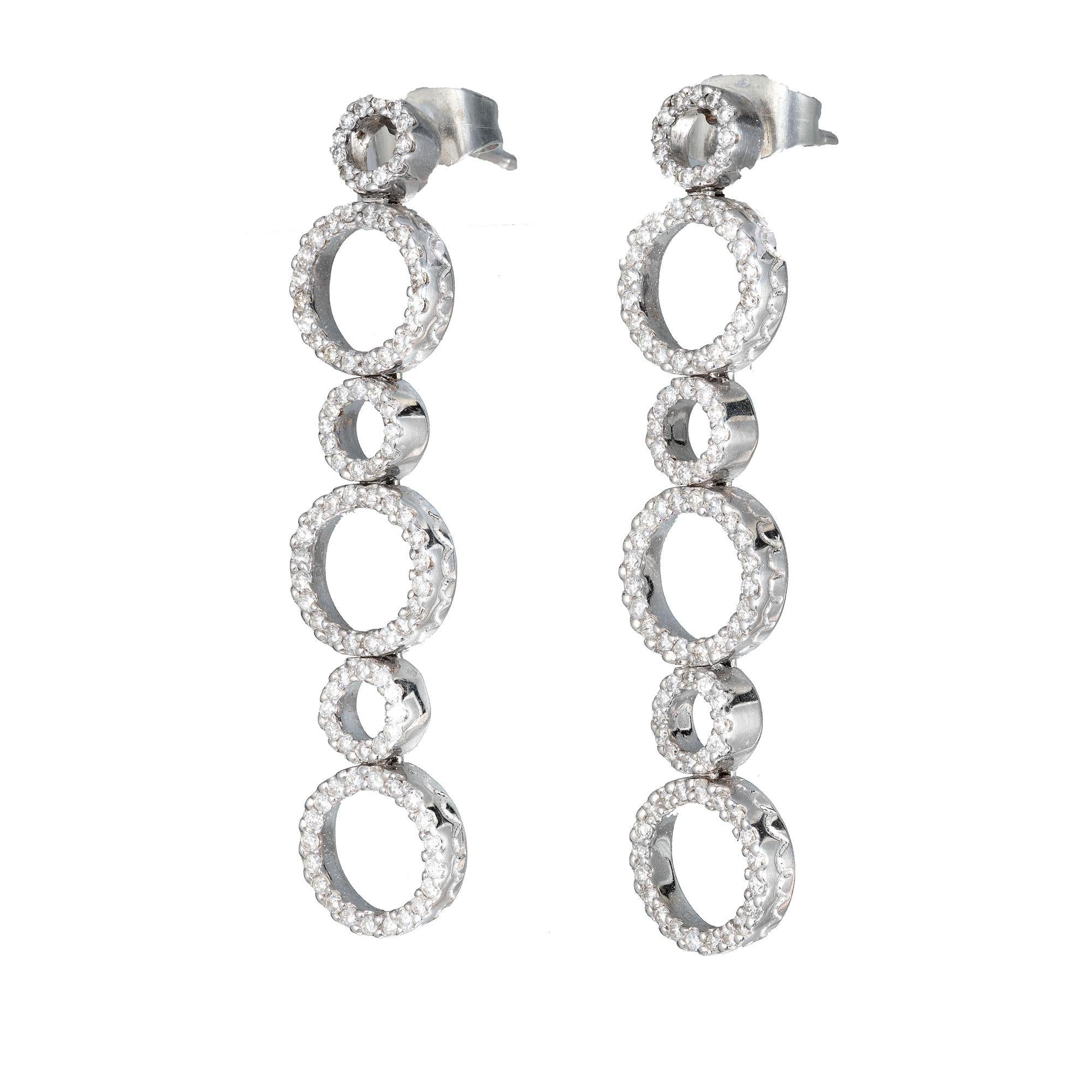 Circle design 14k white gold diamond dangle drop earrings. Common prong set.

192 full cut diamonds, approx. total weight 1.00cts, H, SI
14k White Gold
Tested:  14k white gold
5.9 grams
Top to bottom: 39mm or 1.54 inches
Width:  .32 inch or