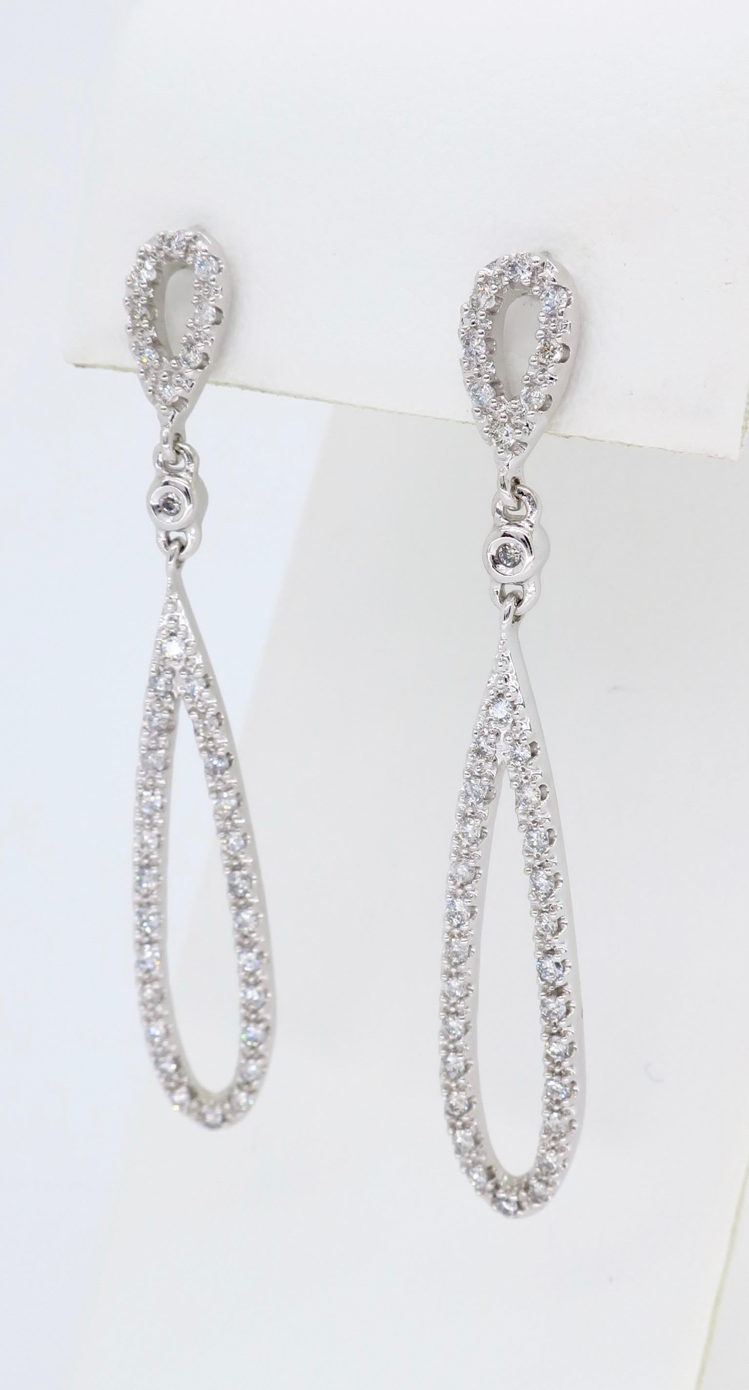 These stunning tear drop shaped diamond earrings contain approximately 1.00CTW of Round Brilliant Cut Diamonds set in 14K white gold.

Diamond Carat Weight: Approximately 1.00CTW 
Diamond Cut:  Round Brilliant
Color: Average G-J
Clarity: Average