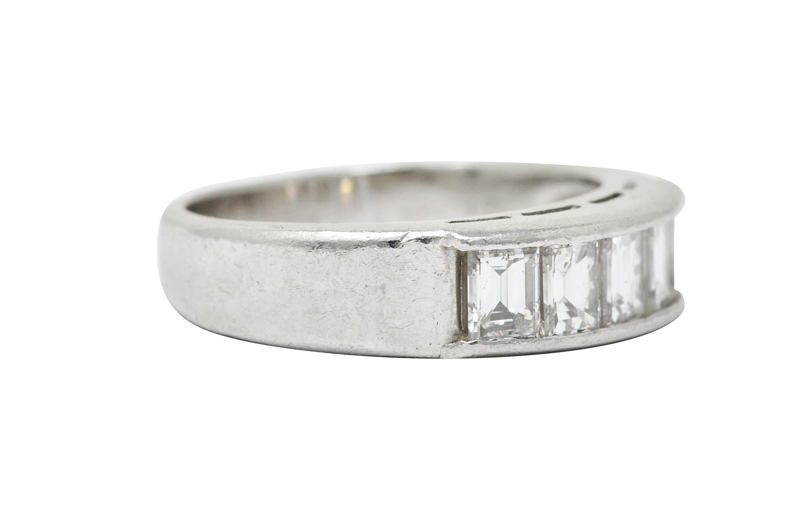 Wide band ring is set to front by five rectangular step cut diamonds

Weighing in total approximately 1.00 carat with H to J color and VS clarity

Stamped Pt900 for platinum

Circa: 2010s

Ring Size: 5 1/4 & sizable

Measures: 5.2 mm wide and sits