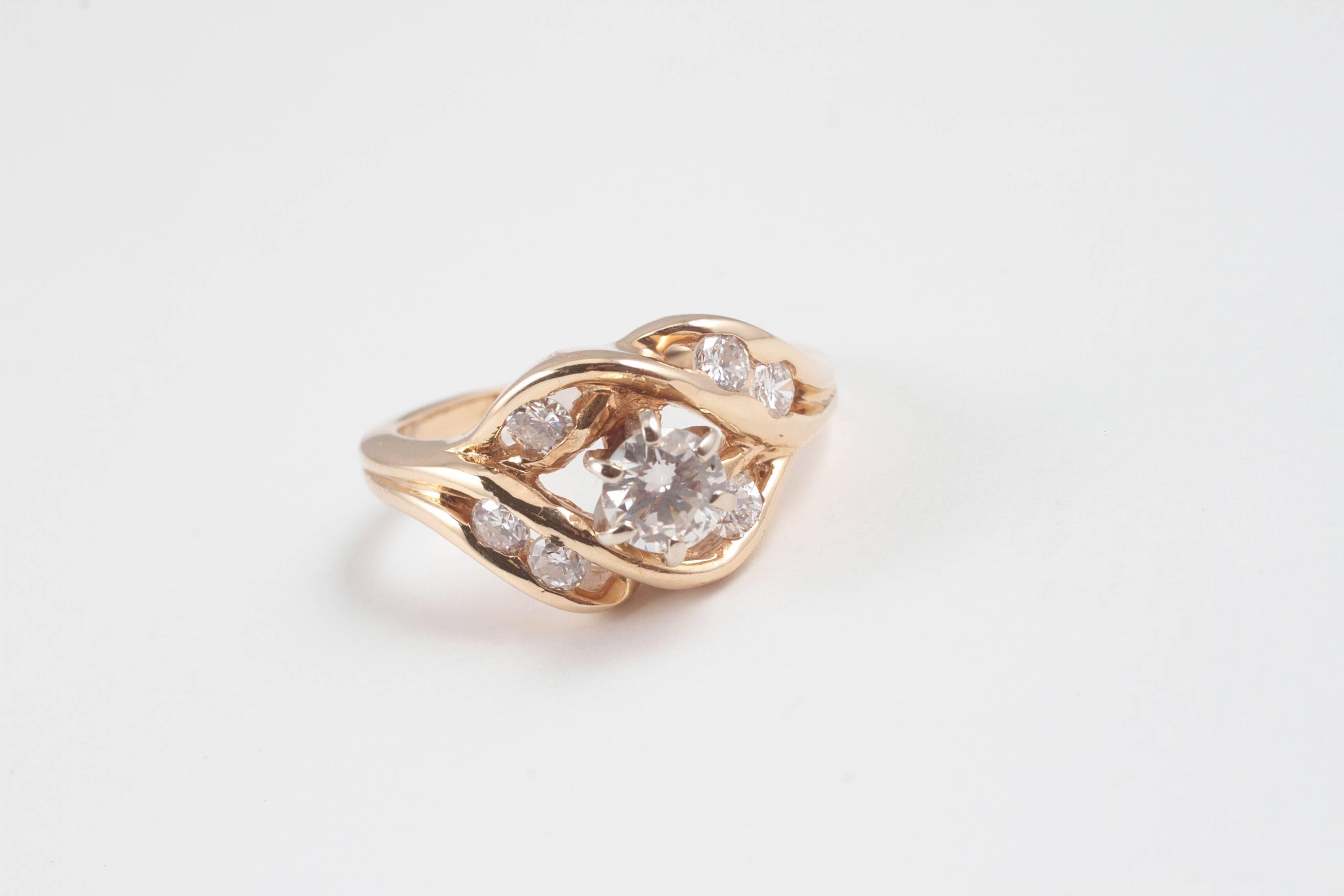 Free-form, 1.00 carat diamond ring in 14 karat yellow gold. A great look! Size 5 3/4.