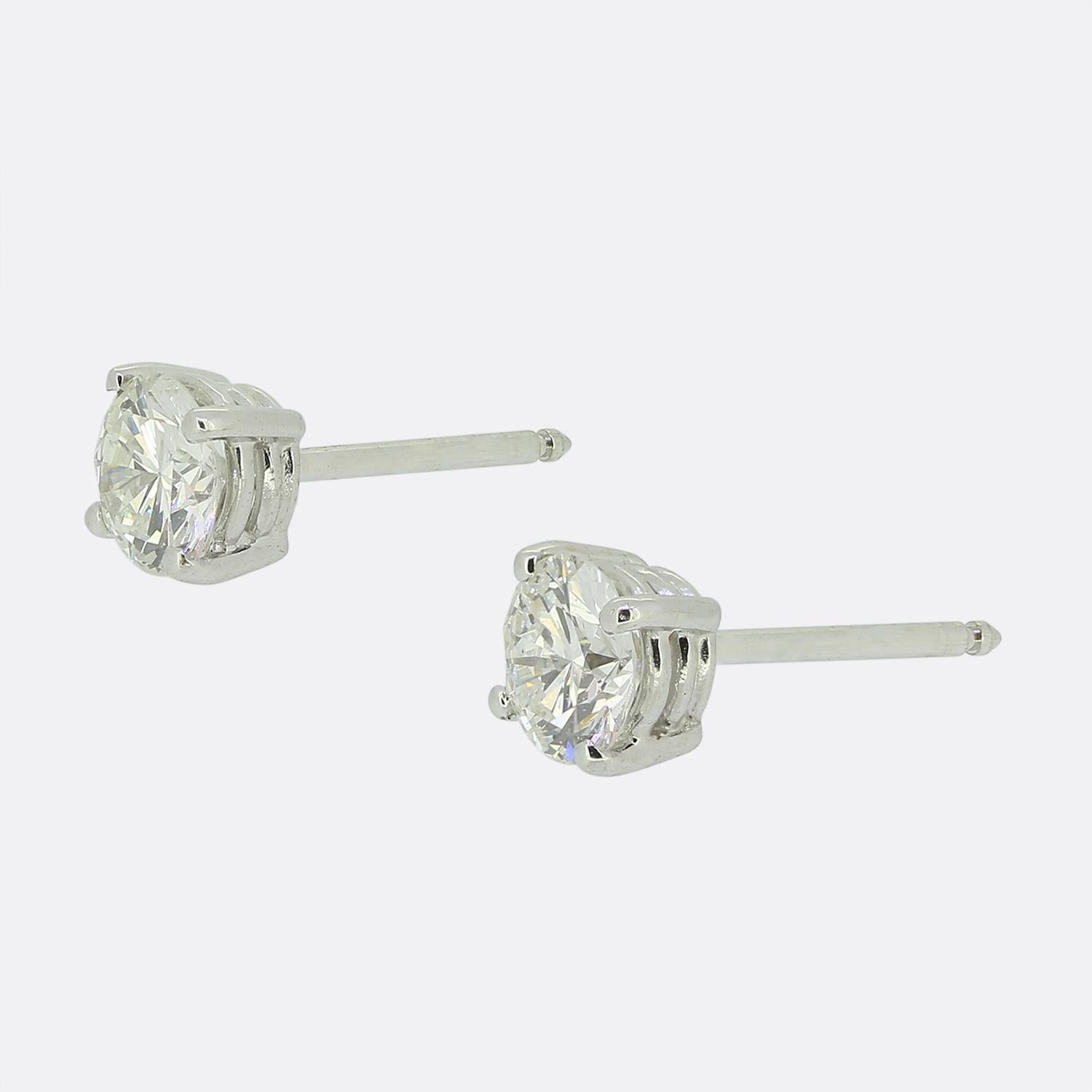 Here we have a classically styled pair of diamond stud earrings. Each piece showcases an 18ct white gold four clawed setting playing host to a single 0.50ct round brilliant cut diamond. Both of which are well matched in terms of colour, clarity,