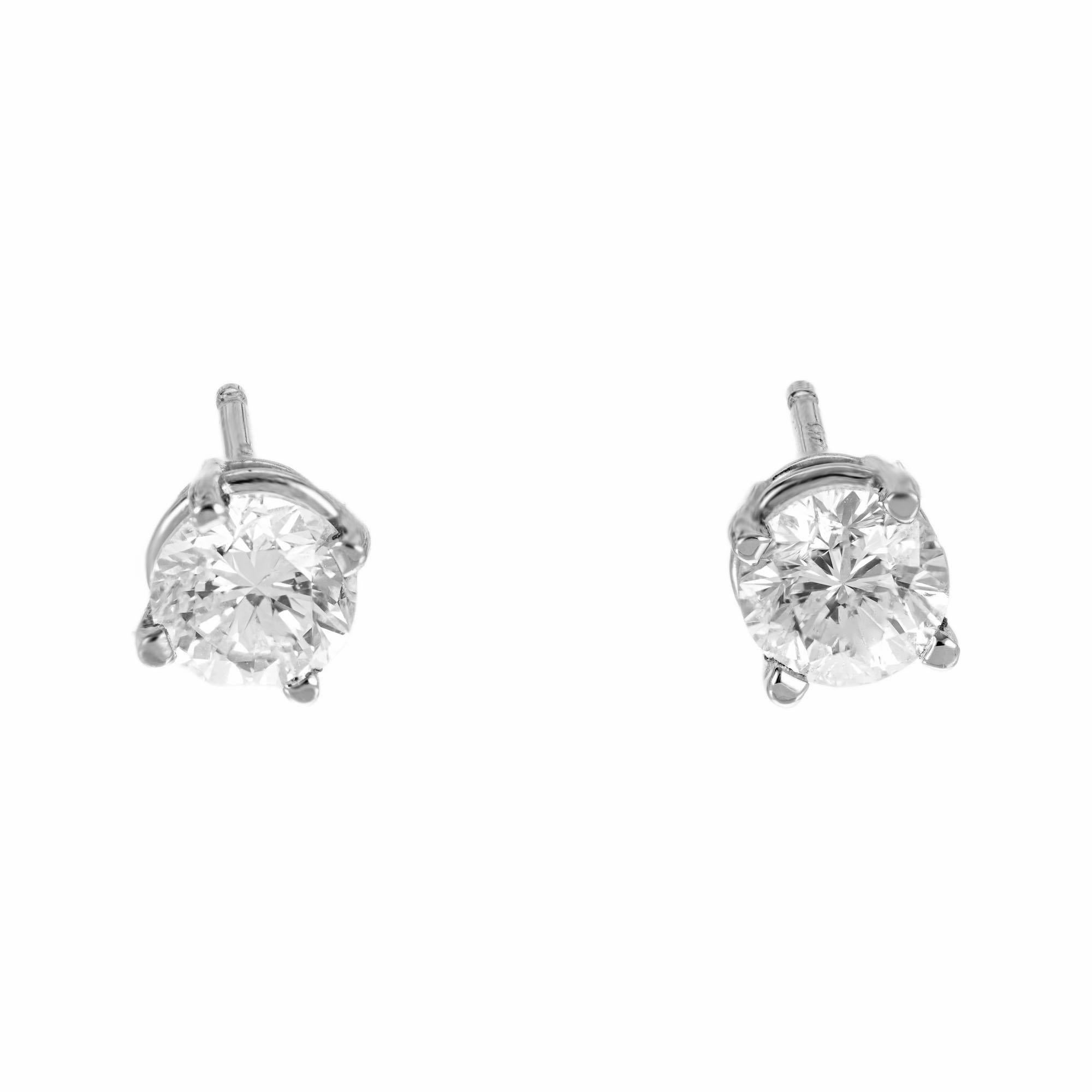 2 round diamond stud earrings, in simple 14k white gold basket settings. 

2 round diamonds, approx. total weight 1.00 H, SI1-SI2
14k white gold
