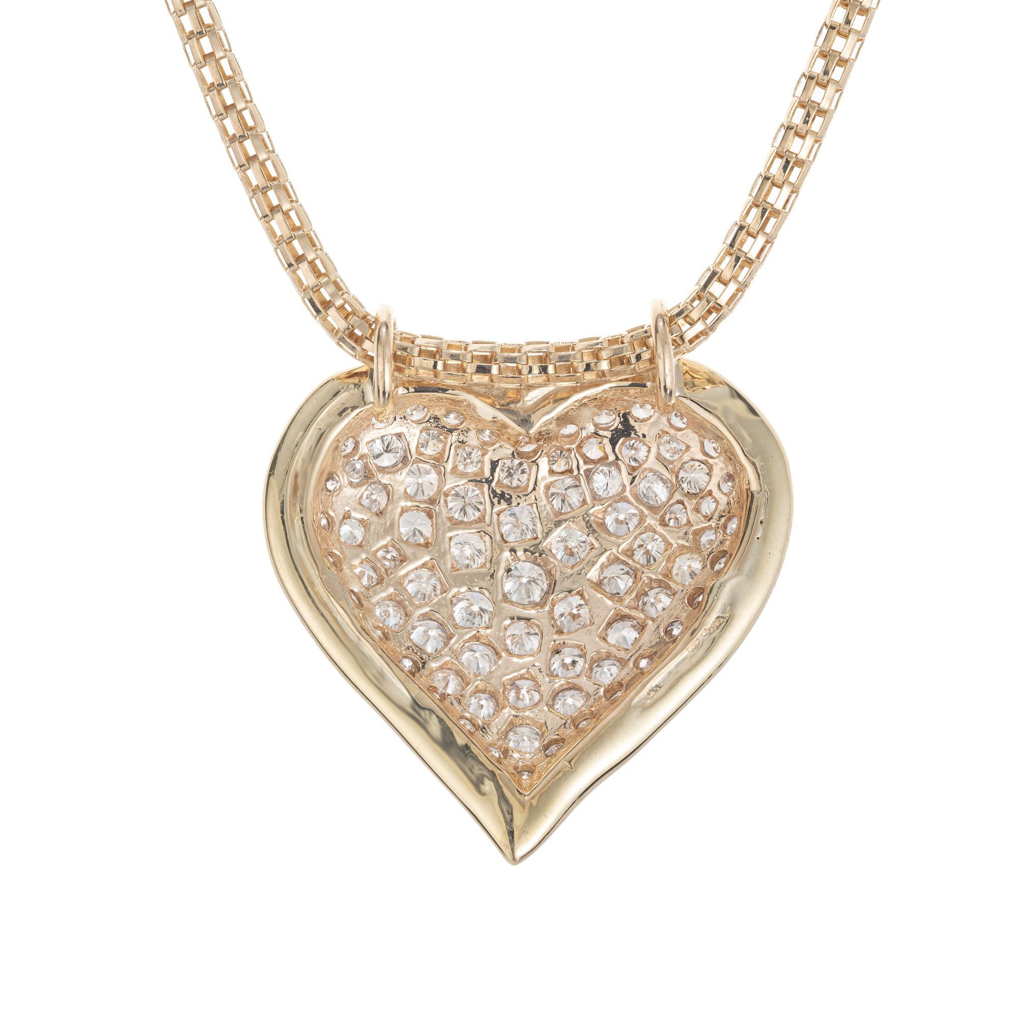 gold heart necklace with diamond in the middle