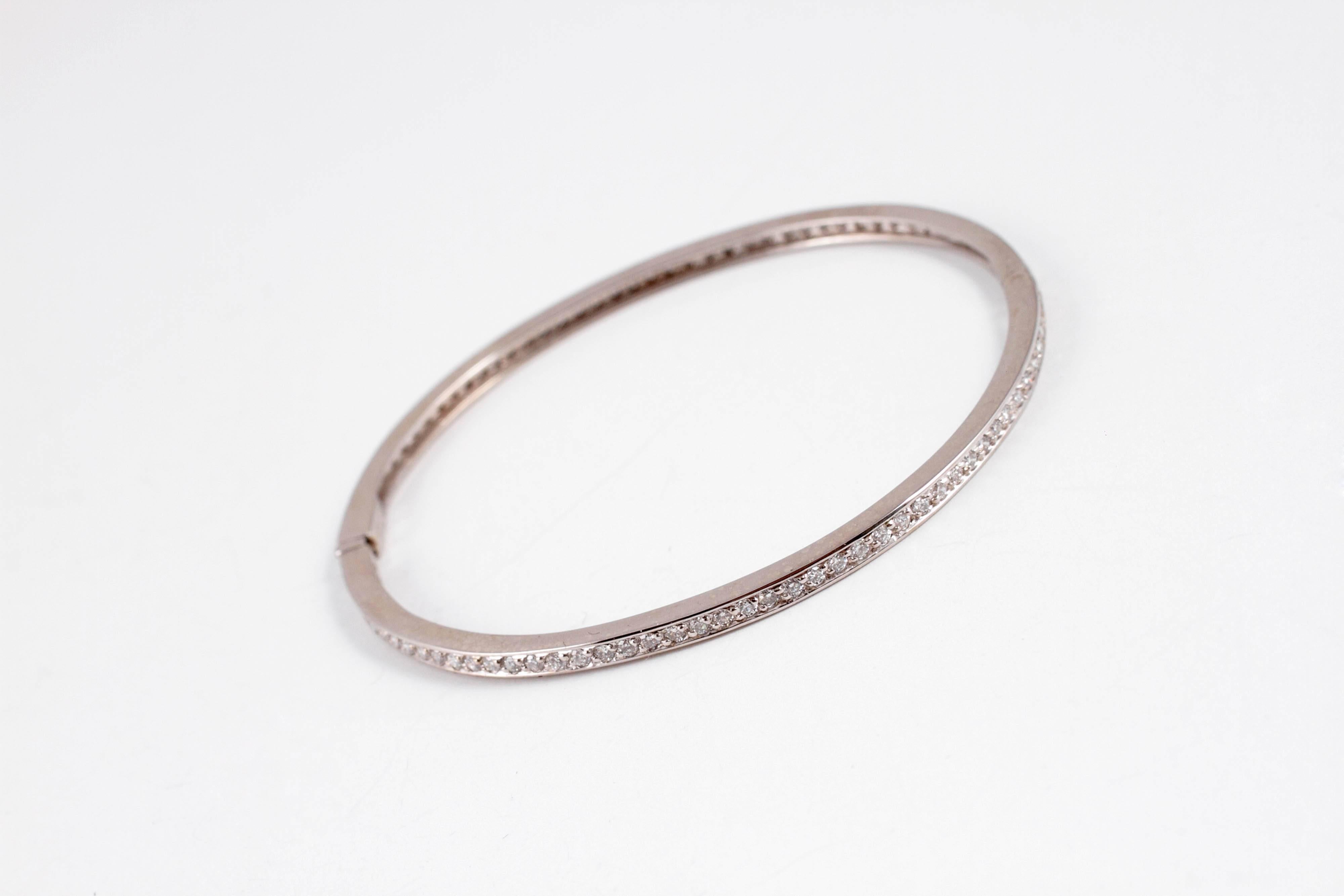 Layer this fun bangle, or wear it alone!  Light on the wrist, in 14 karat white gold.