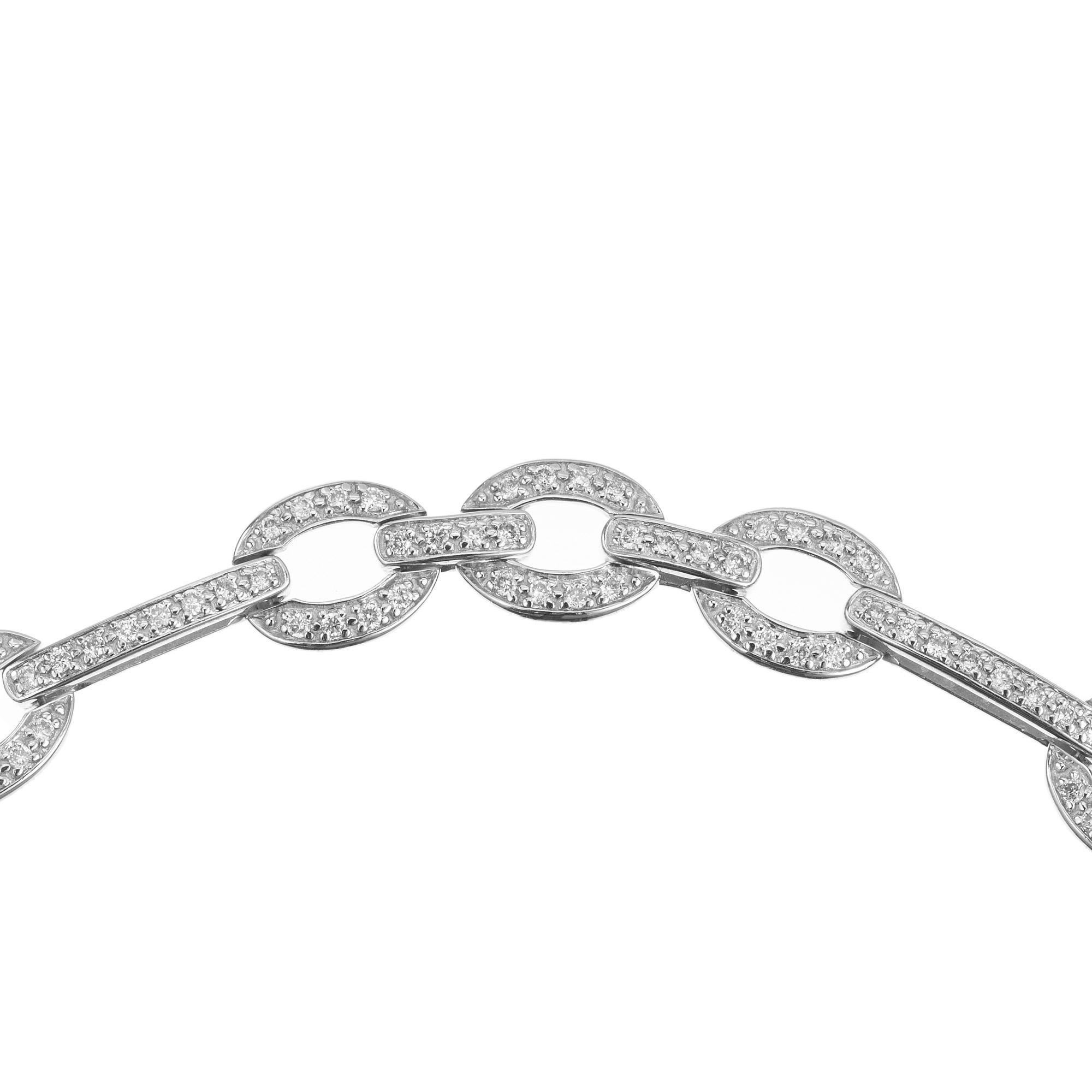 Vintage pave set oval and bar link 14k white gold bracelet with 200 full cut diamonds safely set. The 7.5” bracelet has a fold over catch and safety chain. The link design exudes modernity and versatility, making it perfect for both formal occasions