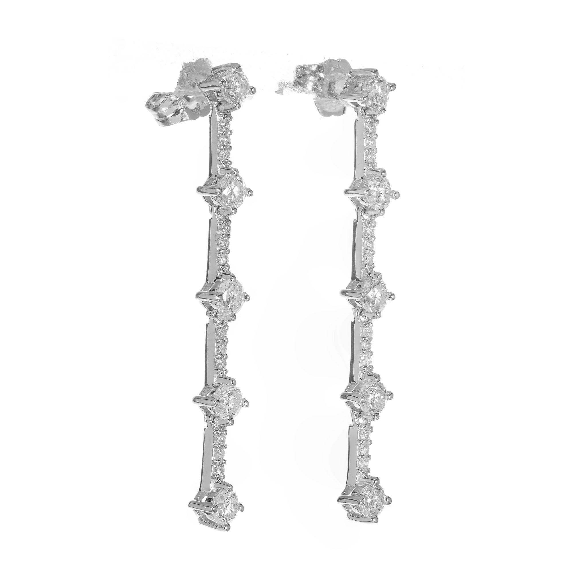 Diamond dangle star dangle drop earrings. 34 round full cut diamonds in 14k white gold. 

34 round full cut Diamonds, approx. total weight 1.00cts, G – H, SI2
14k white gold
Tested and stamped: 14k
2.4 grams
Top to bottom: 35.29mm or 1.39