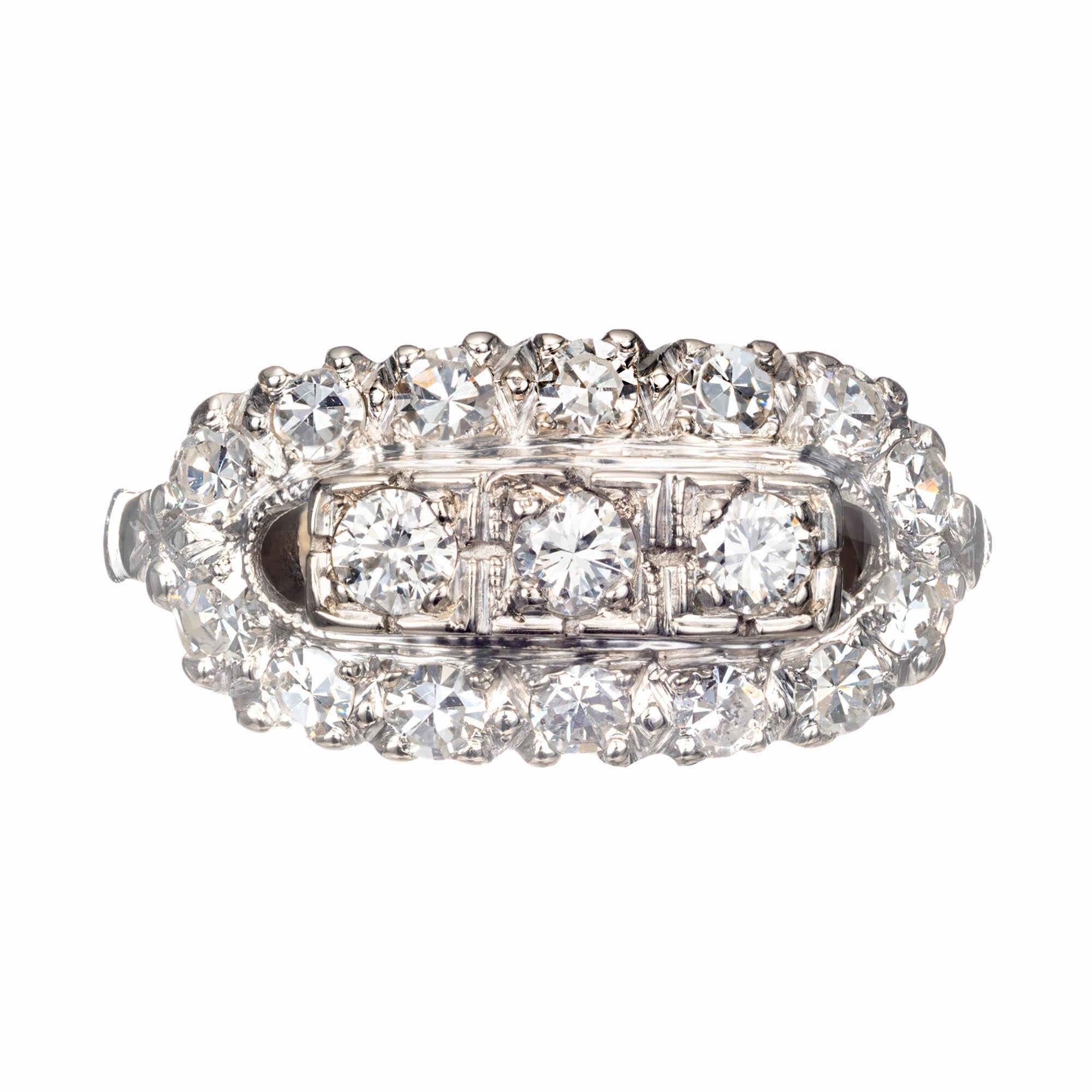 1.00 Carats diamond oval cluster ring. 3 diamonds surrounded by a halo of diamonds in a 14k white gold setting. 

3 round I SI diamonds, Approx. .30 carats
14 round single cut I VS-SI diamonds, Approx. .70 carats 
Size 7 and sizable.  up to