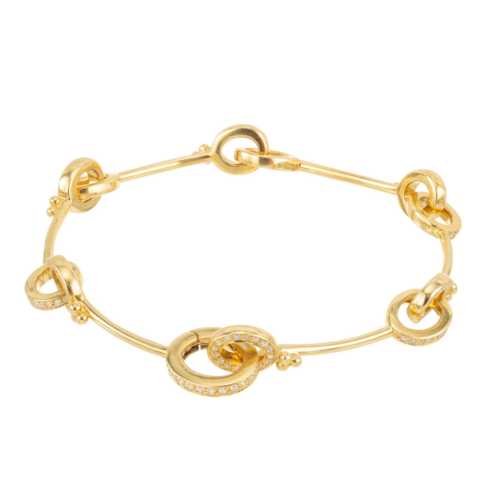 Equestrian motif diamond bracelet. Set with 163 round brilliant cut diamonds. Each 18k yellow gold bar has a oval links at each end that are adorned with diamonds. 7 inches in length. Safe and secure built in catch. 

163 round brilliant cut