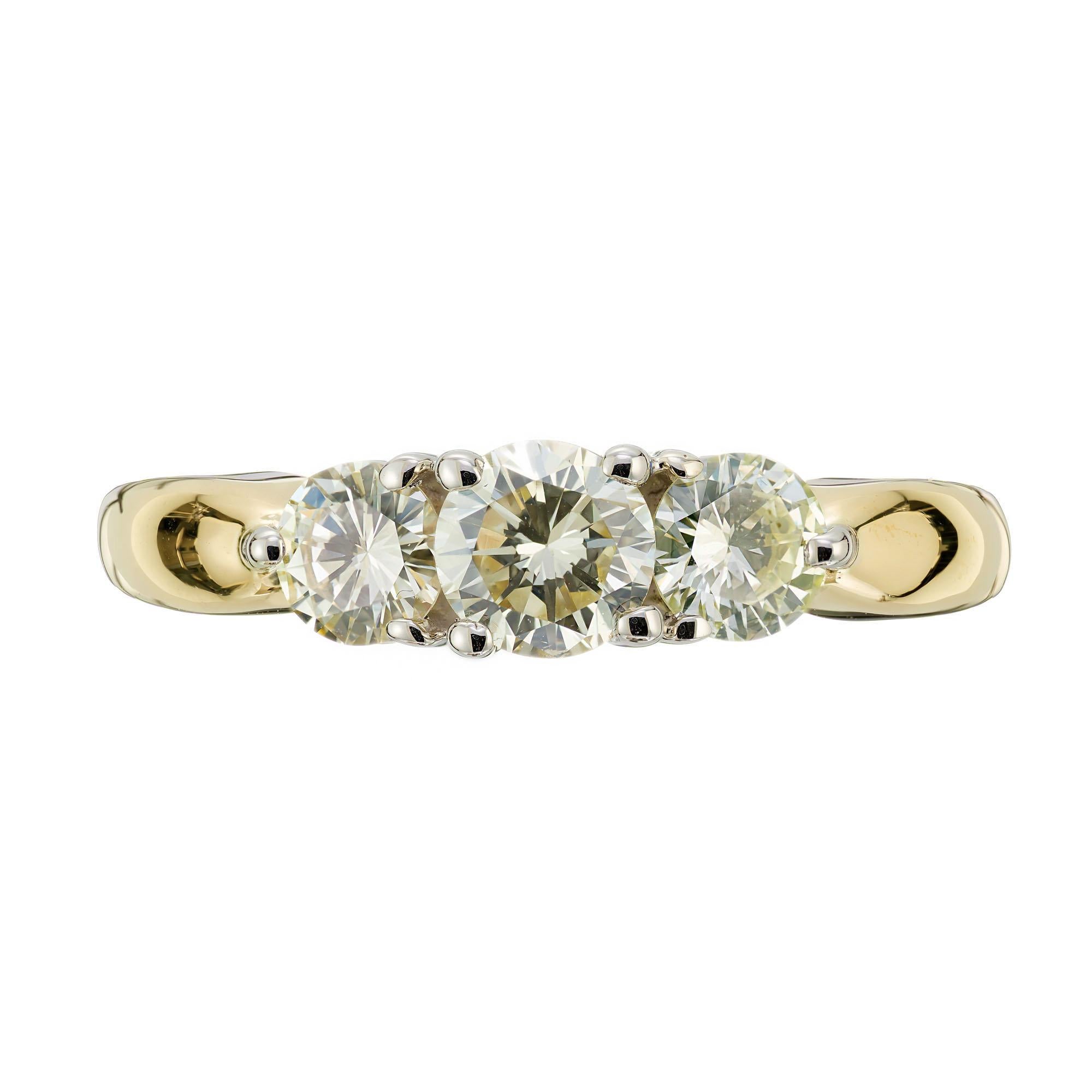 Classic three stone diamond engagement ring. .38 carat center stone with 2 round brilliant cut side diamonds in a 14k yellow and white gold setting. 

1 round brilliant cut diamond, K VS approx. .38cts
2 round brilliant cut diamonds, J-K VS approx.