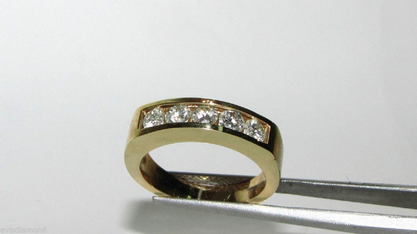 Classic Channel band

1.00ct. diamonds 

H-color, Vs-2  clarity

14kt. yellow gold

5mm wide

14kt. yellow gold

5.4 grams.

$5000 appraisal will accompany

current size 6

can be resized, please inquire first