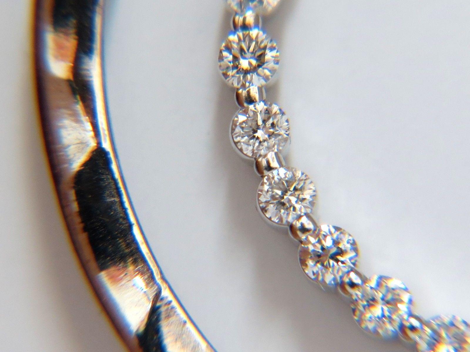 Circle within Circle.

1.00ct. round diamonds circle & Diamonds station necklace.

 Full cut brilliant Round diamonds.

 Vs-2  Clarity. 

G-H color.

14kt. white gold 

Diameter: 1.1 inch.

Necklace: 16 inches.

12 grams.

$6,000 Appraisal