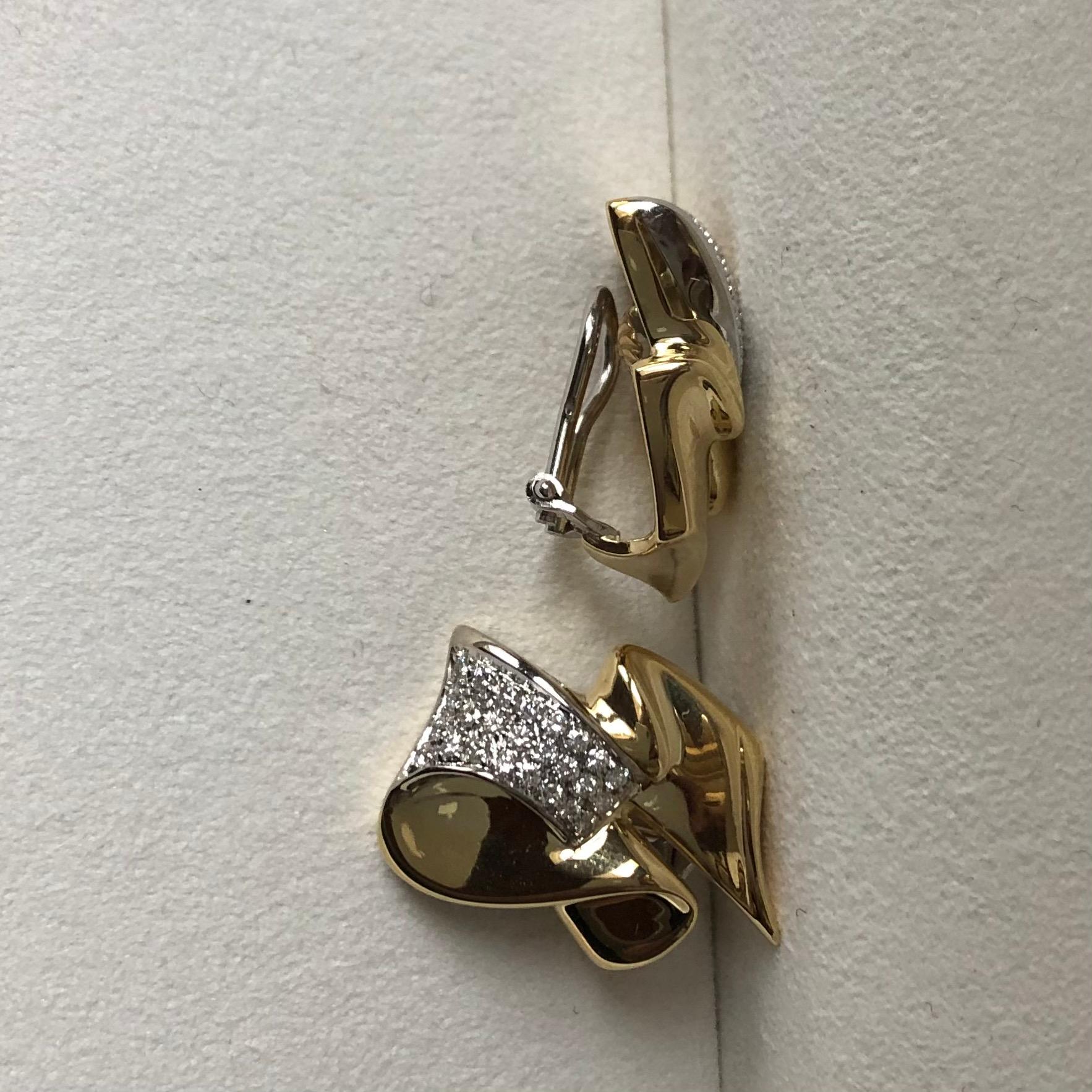 A 1.00 carat diamonds on 18k yellow and white gold clip earrings. 
An everyday pair of earrings with clips, although easy to adjust for pierced ears.

Diamonds are beautifully pavé set in white gold in order to enhance their brilliancy.

50