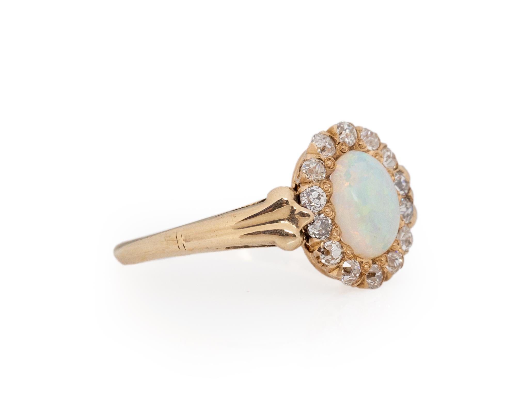 Ring Size: 6.25
Metal Type: 18Karat & 14Karat Yellow Gold [Hallmarked, and Tested]
Weight: 2.0 grams

Center Details:
Type: Opal, Natural
Weight: 1.00carat
Cut: Oval Cabachon

Side Stone Details:
Weight: .40carat, total weight
Cut: Antique European