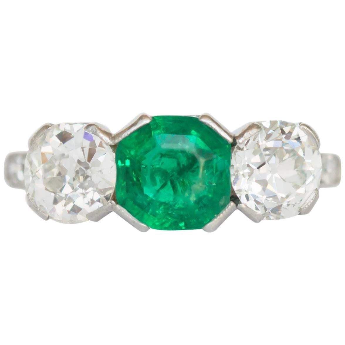 1.00 Carat Emerald and Diamond Platinum Engagement Ring For Sale