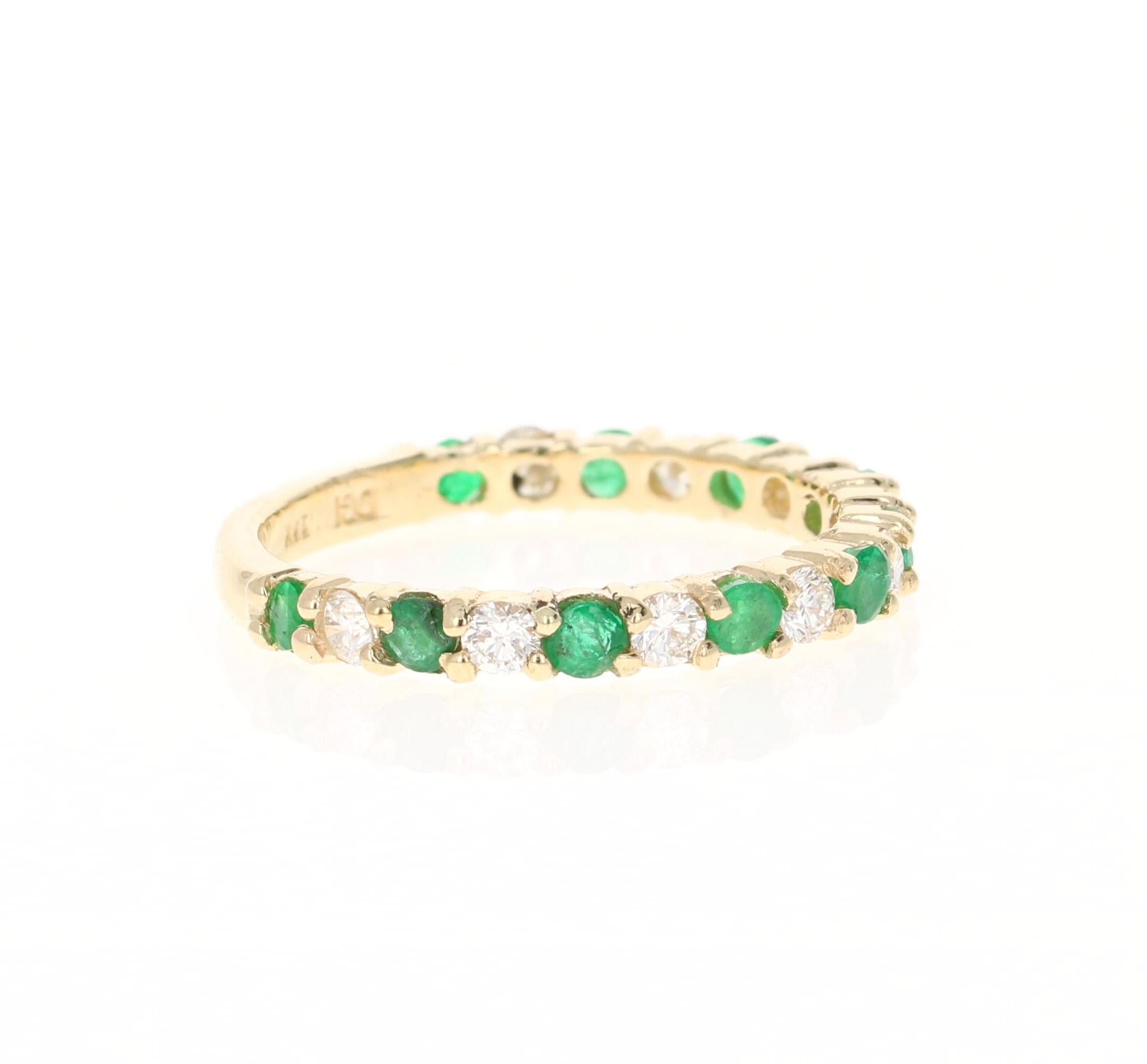 There are 10 Round Cut Emeralds that weigh 0.55 Carats and 9 Round Cut Diamonds that weigh 0.45 carats (Clarity: VS, Color: H).  The total Carat Weight of the band is 1.00 Carats. The band is made in 14K Yellow Gold and weighs approximately 2.9