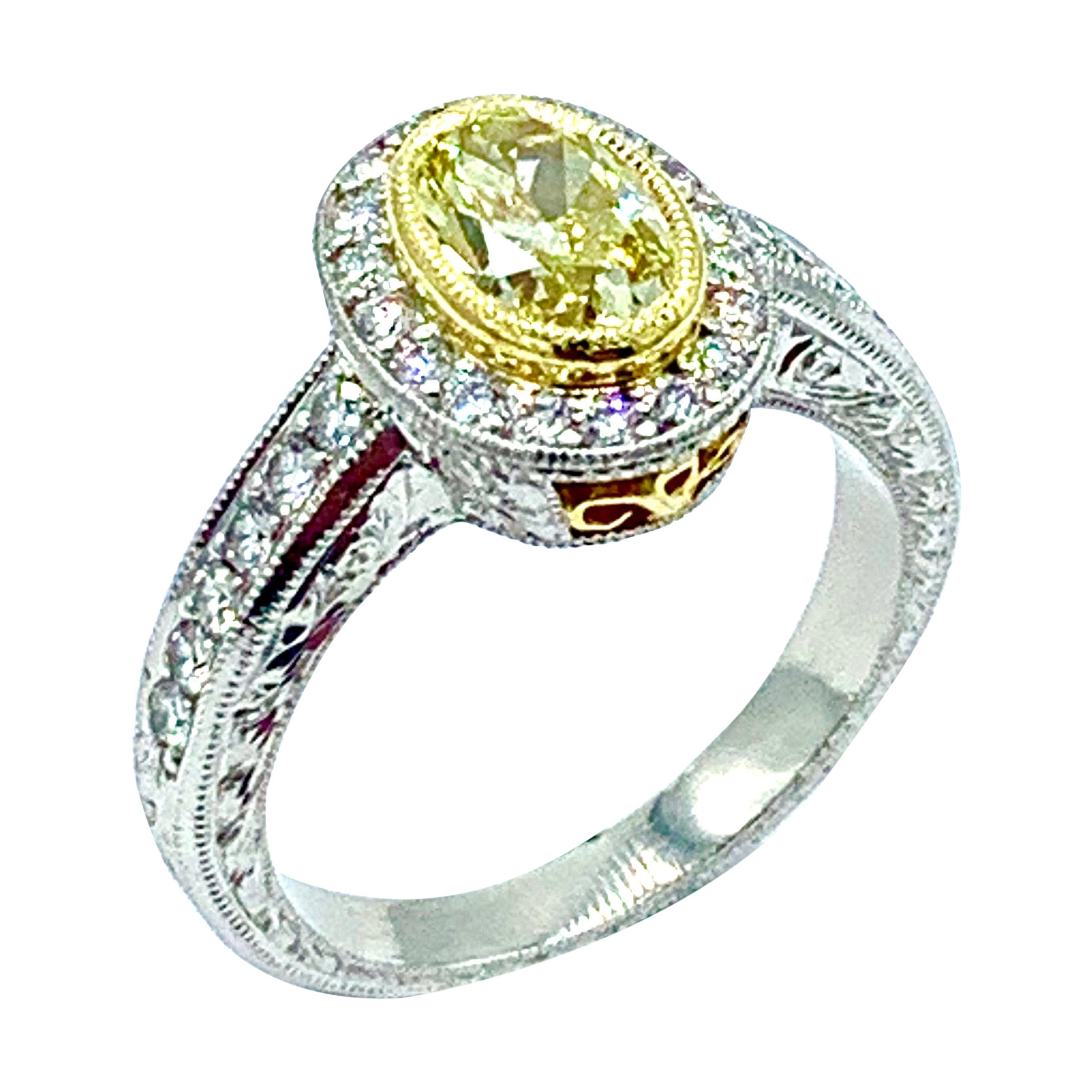 1.00 Carat Fancy Yellow Oval Diamond Platinum and Yellow Gold Engagement Ring
