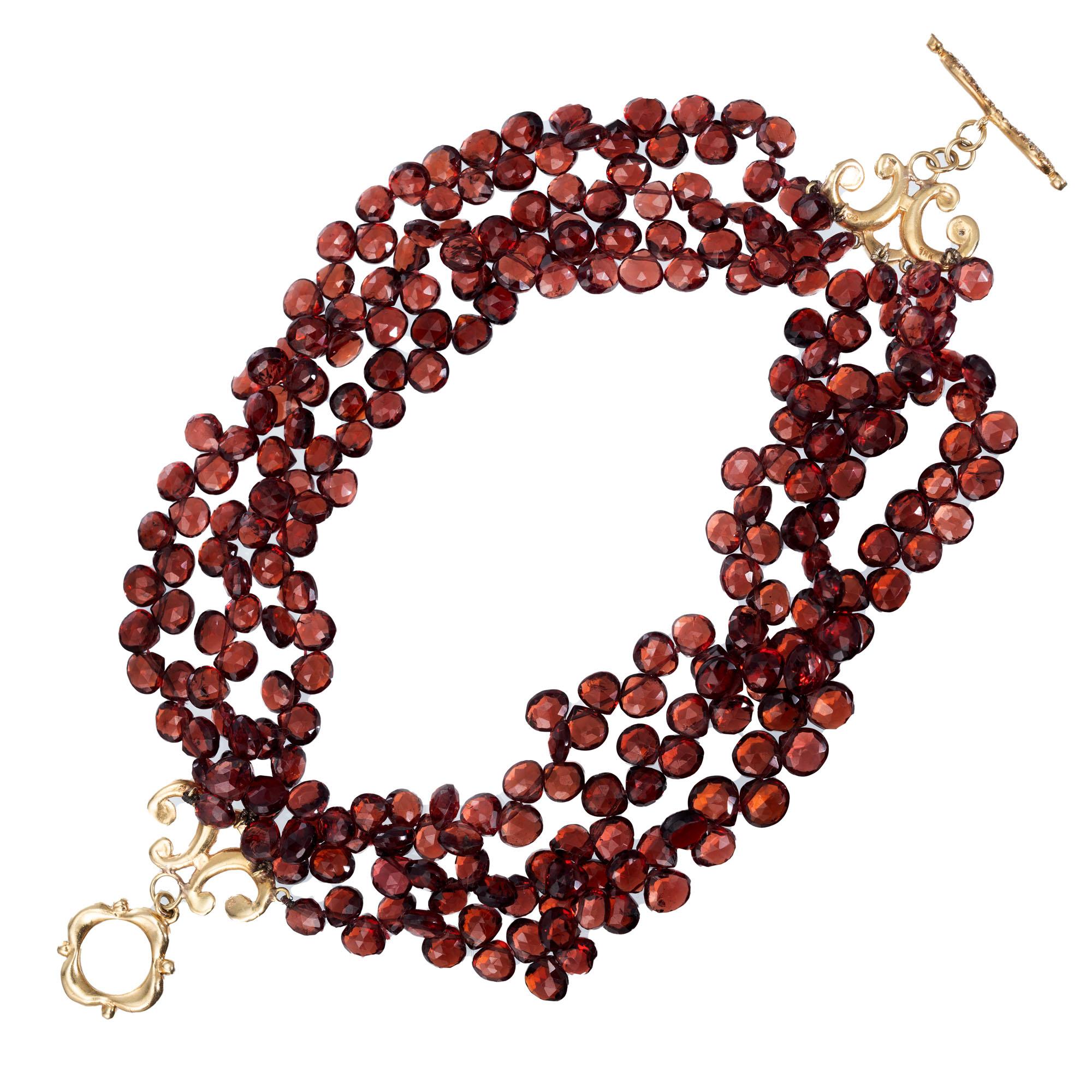 Six row faceted garnet bead bracelet with 94 round pave set accent diamonds in a 18k yellow gold toggle catch. 7.25 inches  

253 faceted brownish red garnet beads, approx. 1.00cts
94 round brilliant cut diamonds G SI, approx. 1.35cts
18k yellow