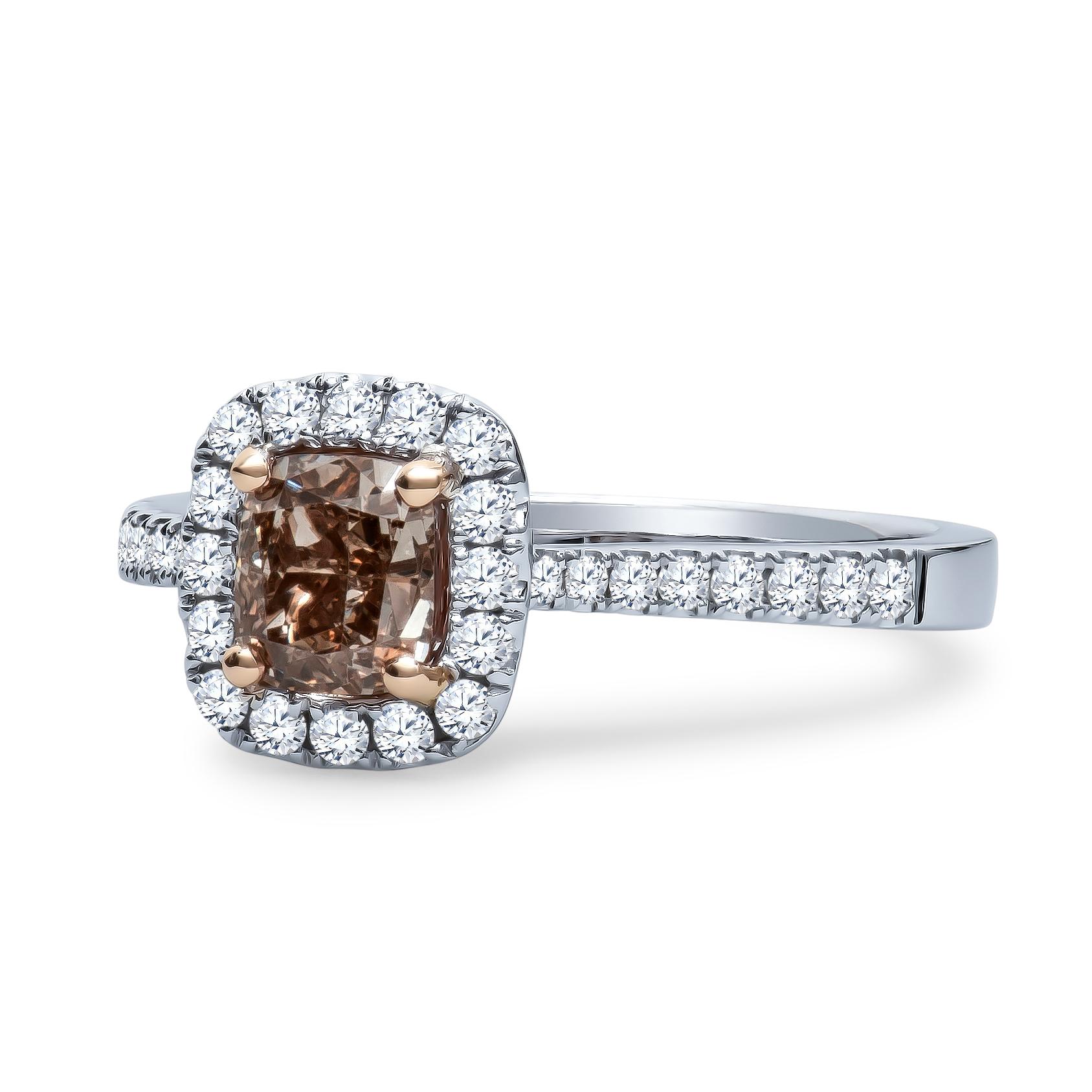 Beautiful 1.00 Carat , GIA certified, SI1 fancy orange brown diamond with 0.34 carats total of split prong set round brilliant diamonds set in an 18K white gold cathedral ring. Ring is sized 6.5, may be resized to larger or smaller upon